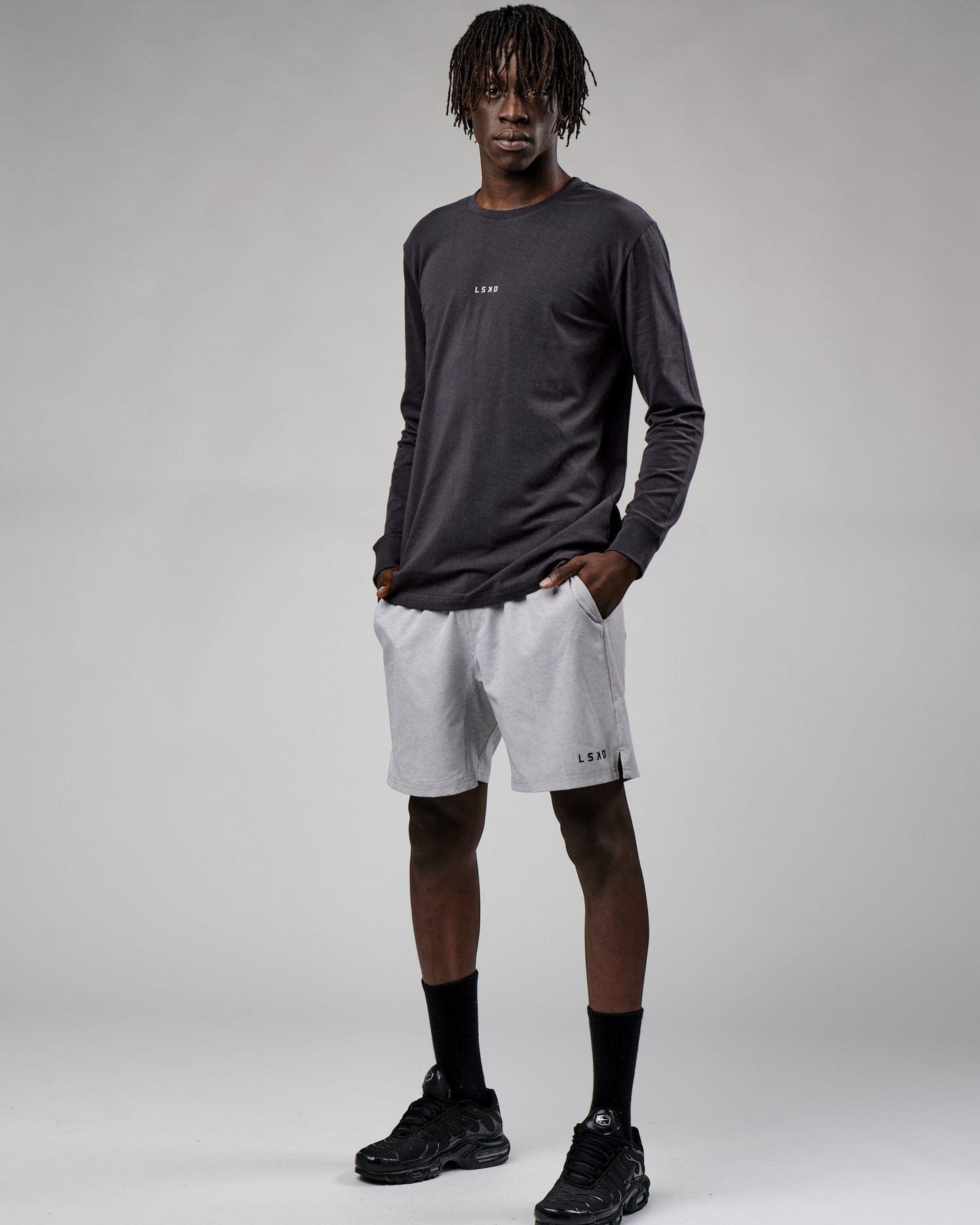 Model wearing Base LS Tee - Phantom