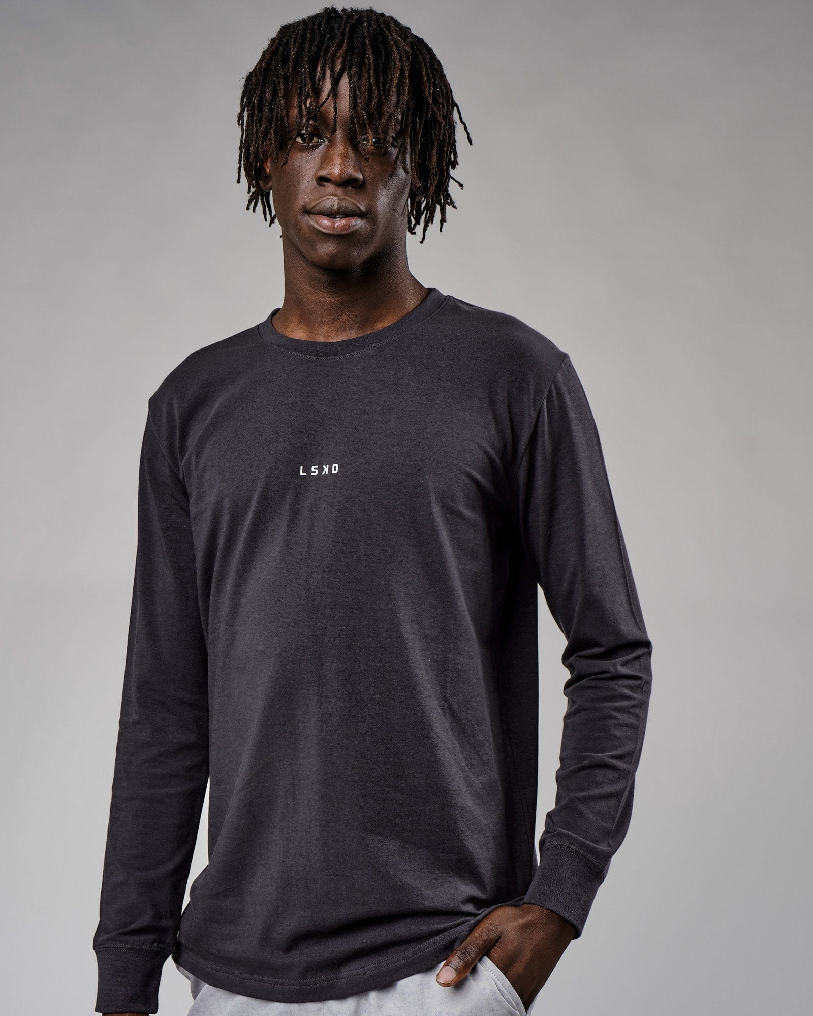 Model wearing Base LS Tee - Phantom