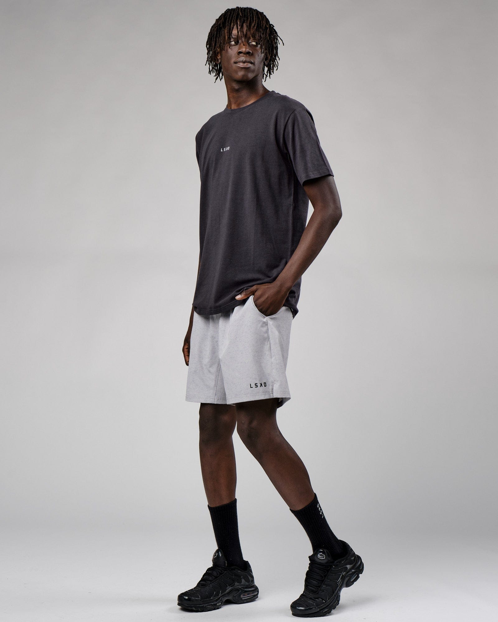 Model wearing Base Tee - Phantom