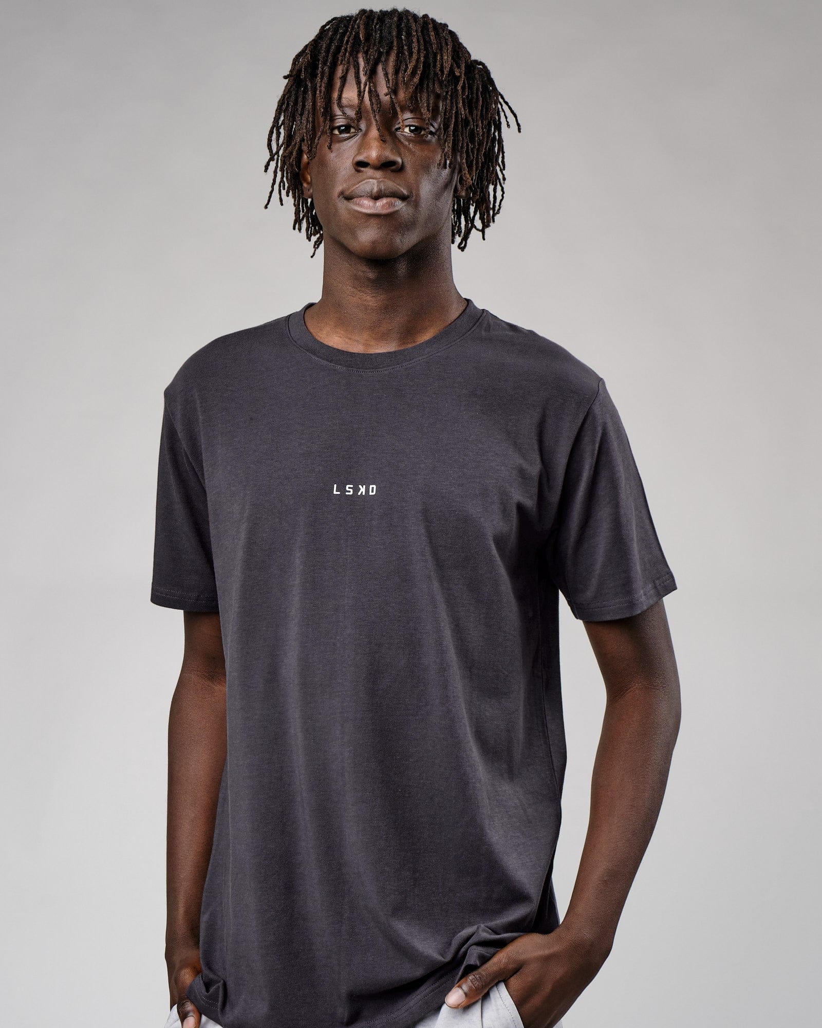 Model wearing Base Tee - Phantom