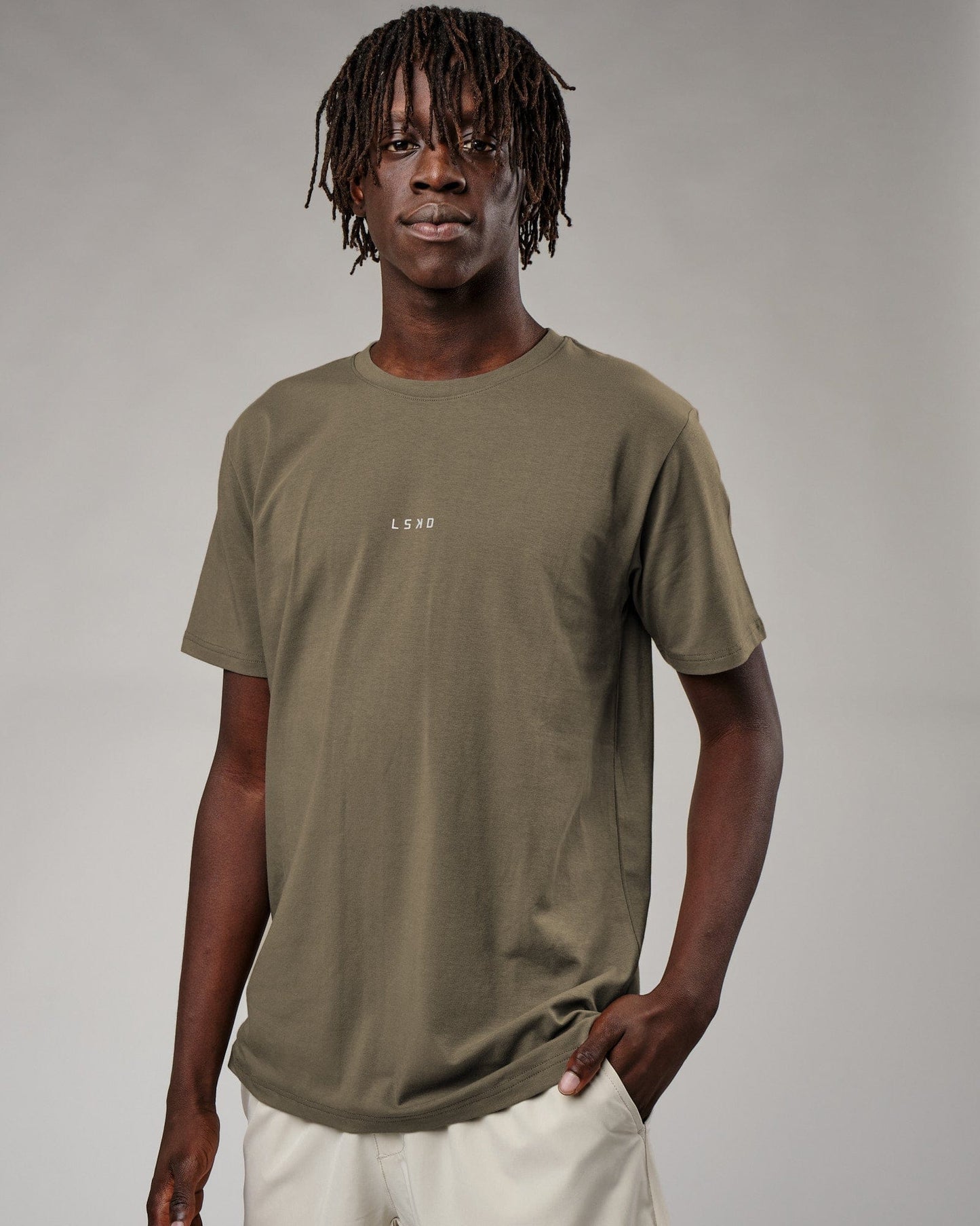 Model wearing Base Tee - Walnut Grey
