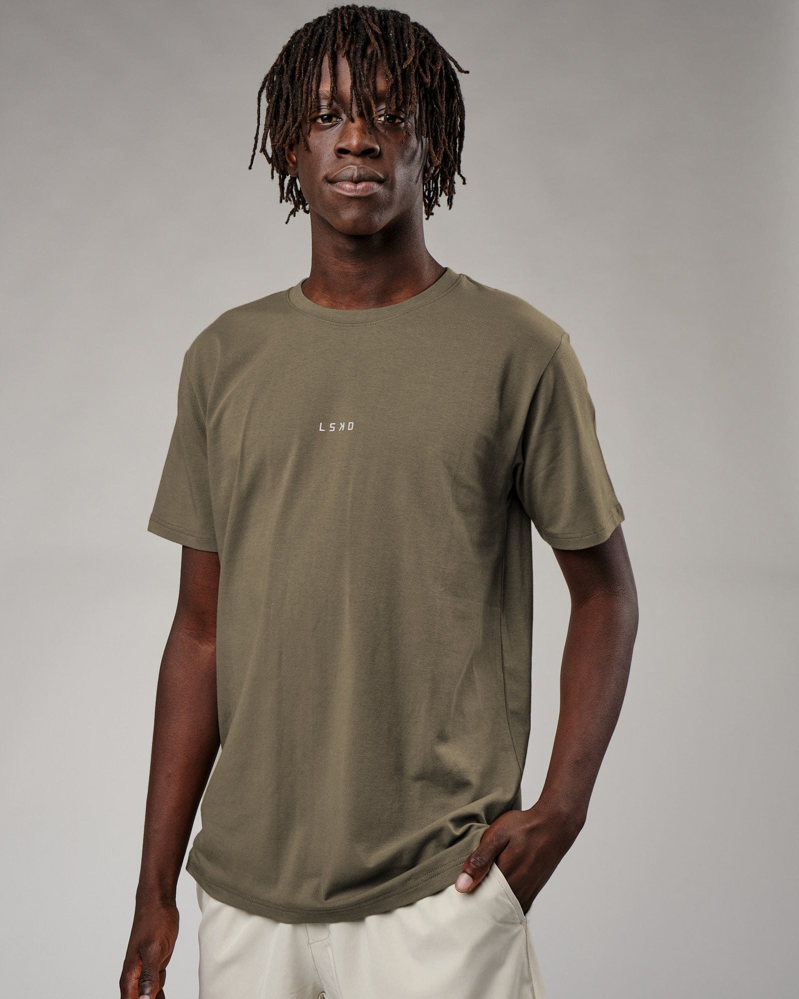 Model wearing Base Tee - Walnut Grey