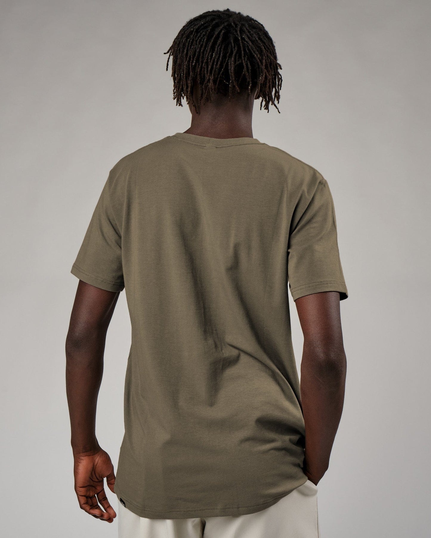 Model wearing Base Tee - Walnut Grey