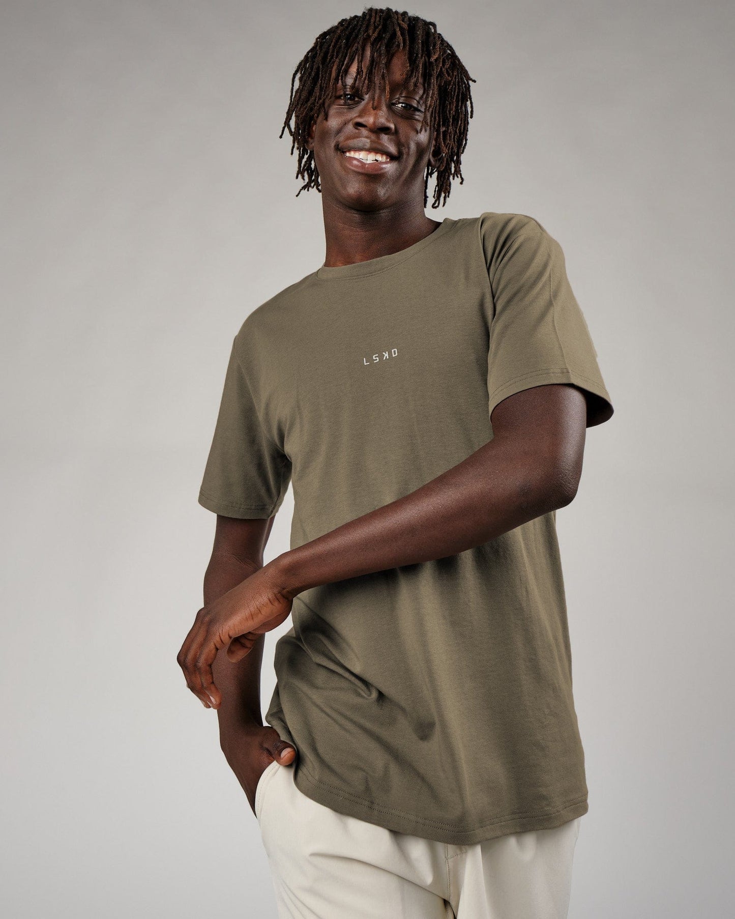 Model wearing Base Tee - Walnut Grey