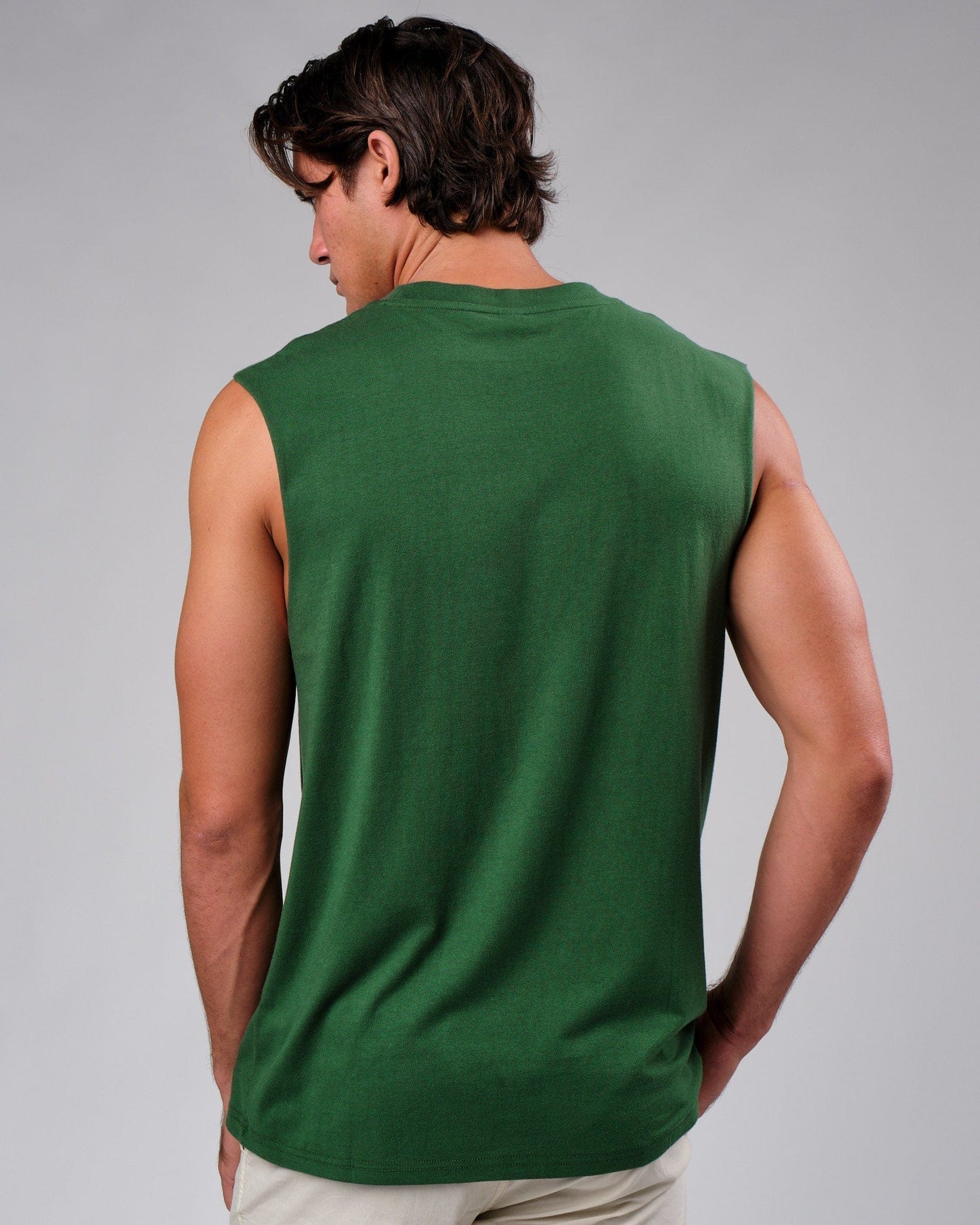 Model wearing Badge Tank Oversize - Eden Green