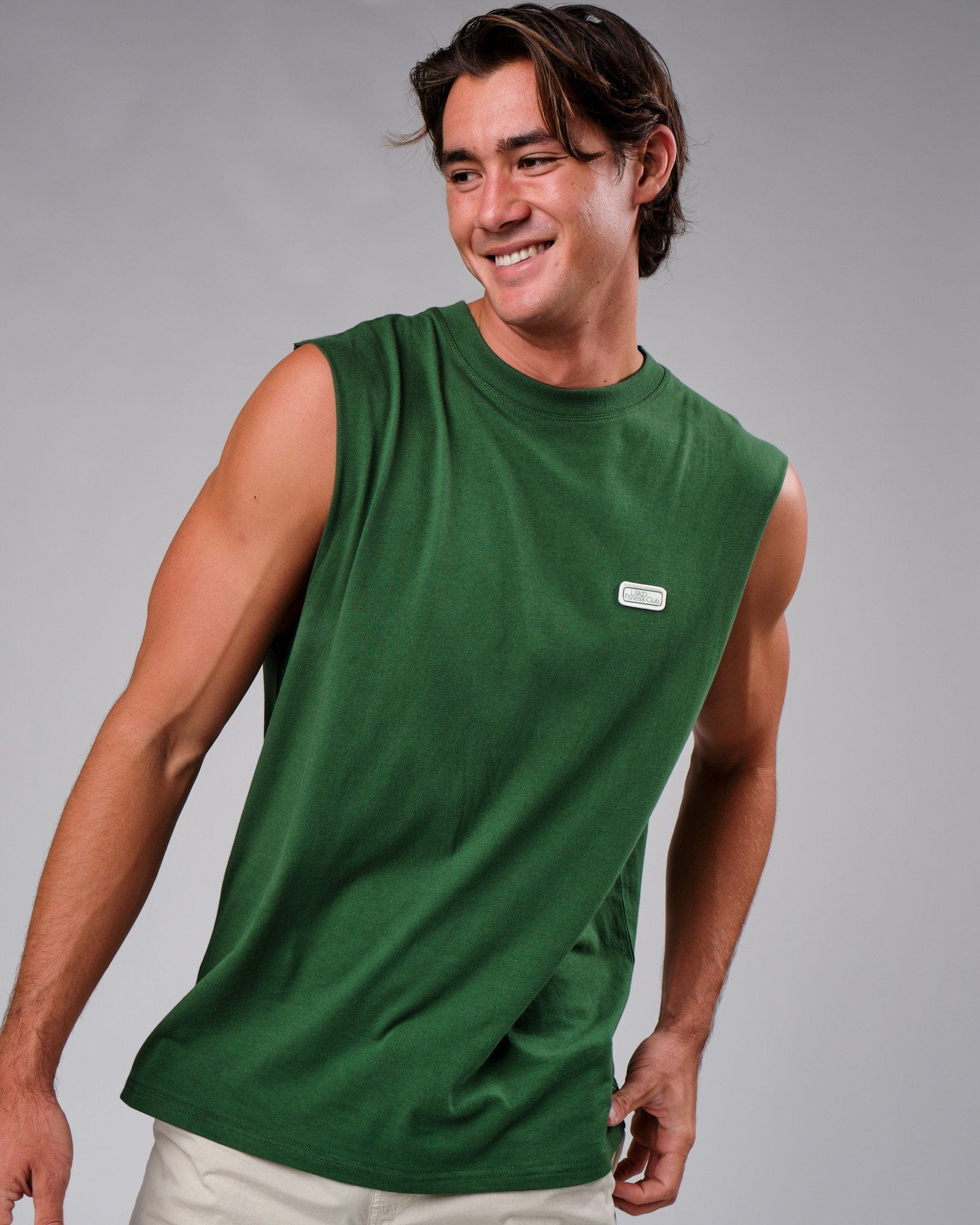Model wearing Badge Tank Oversize - Eden Green