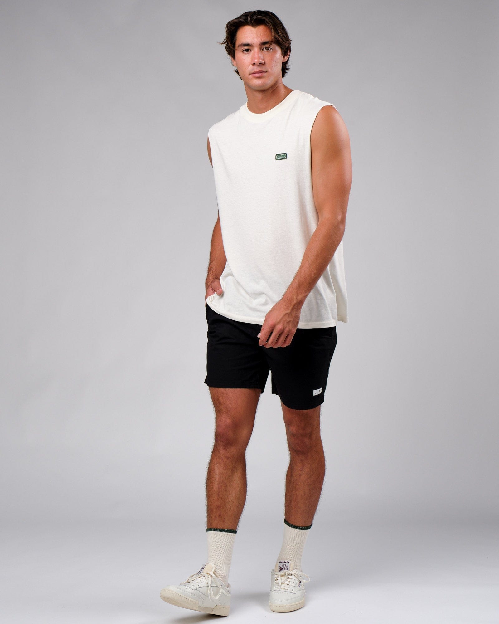 Model wearing Badge Tank Oversize - Cream