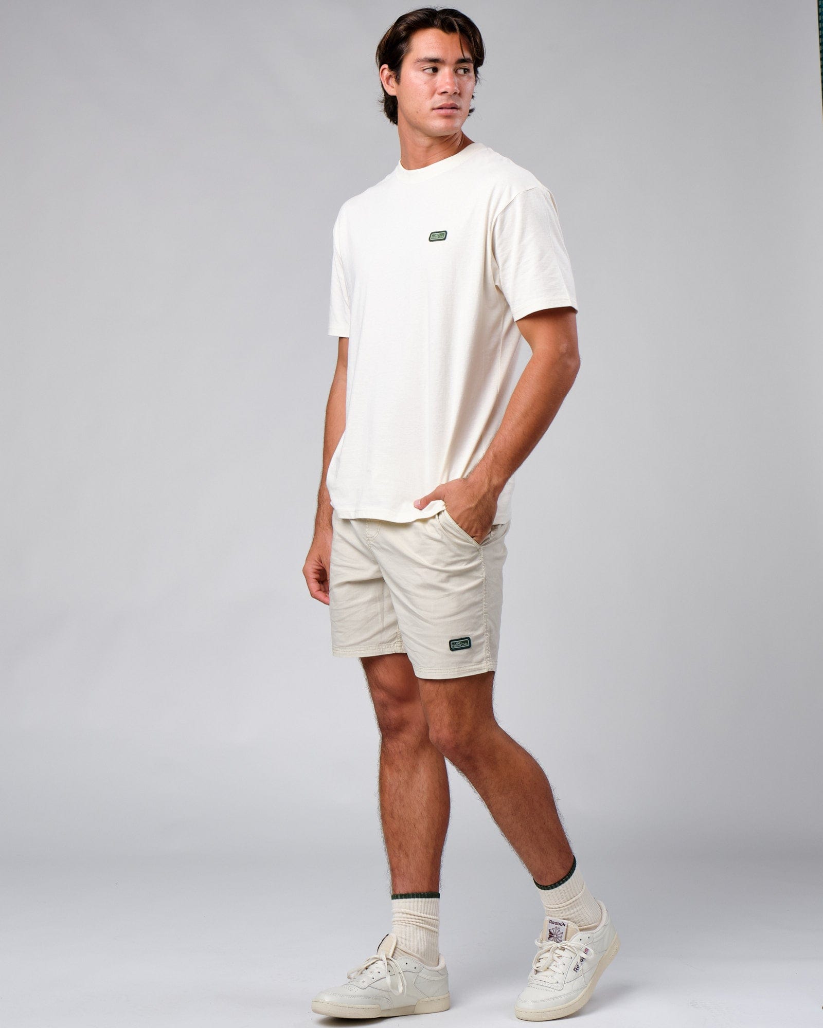 Model wearing Badge Tee Oversize - Cream