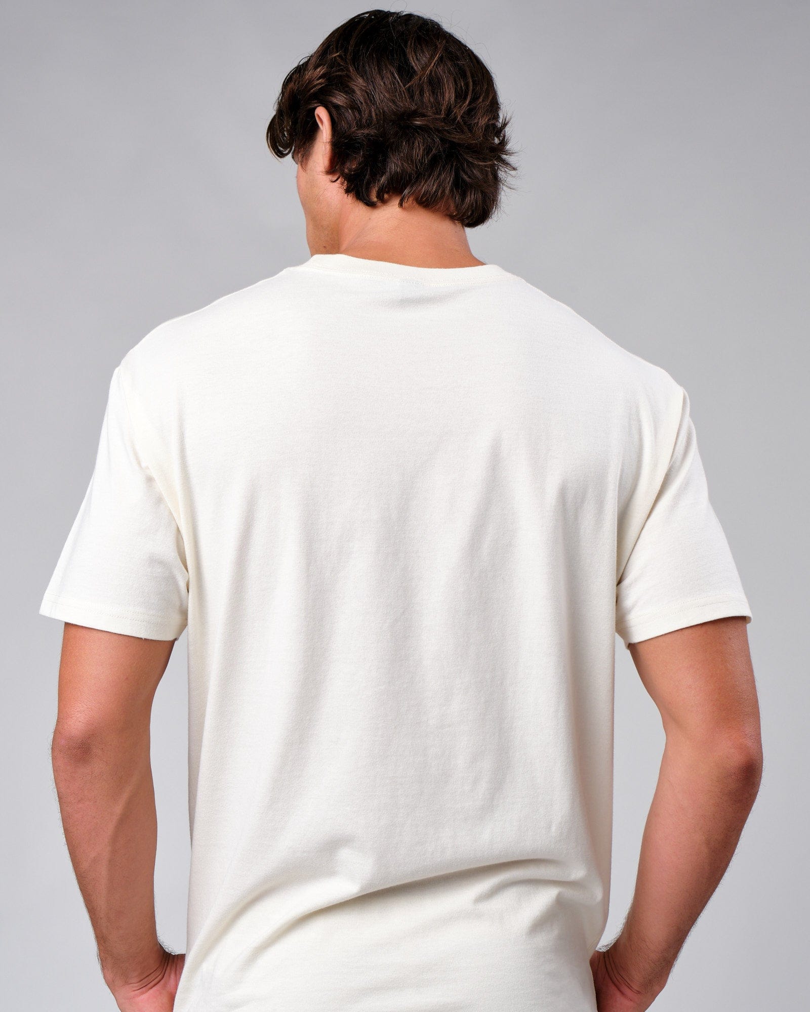 Model wearing Badge Tee Oversize - Cream