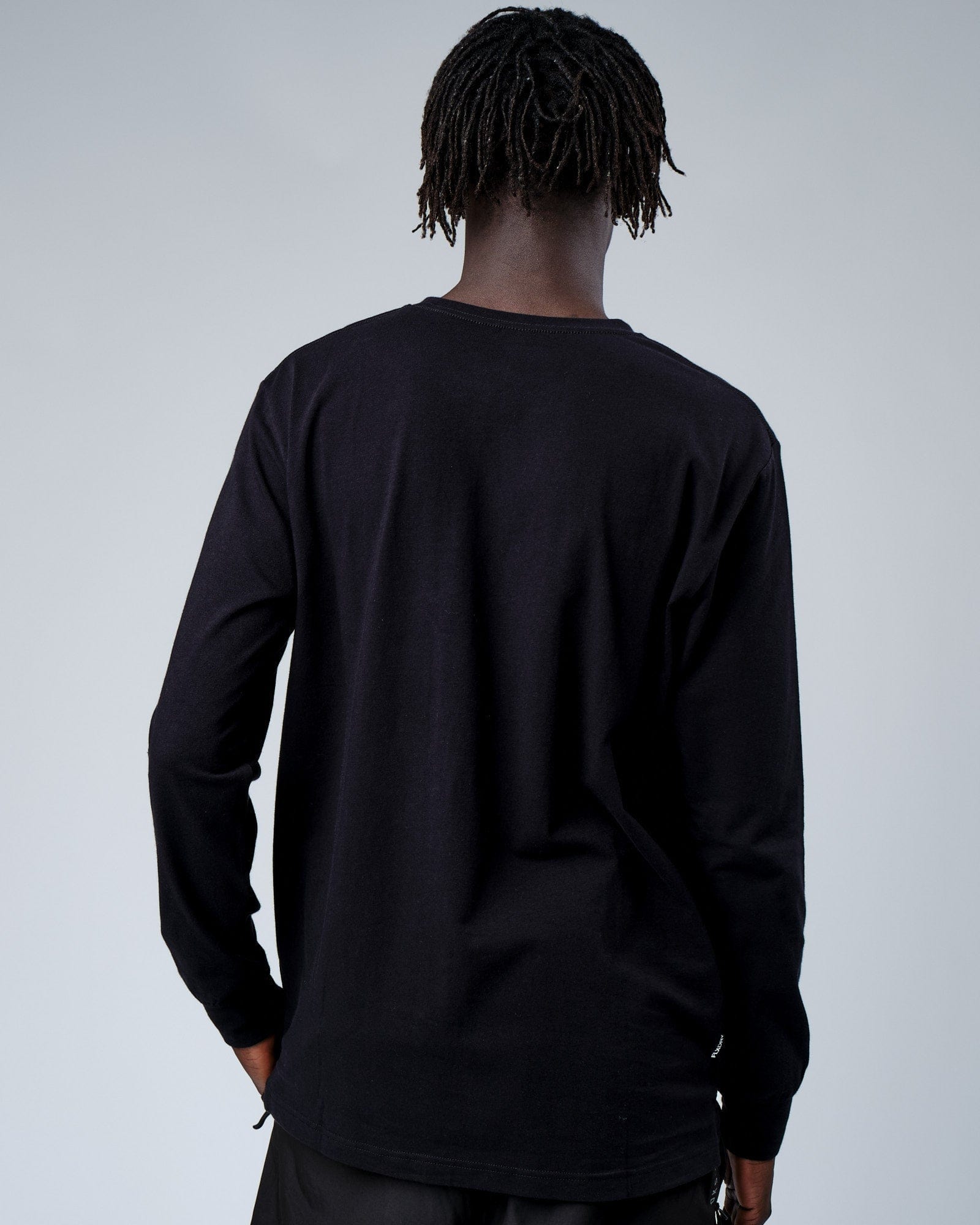 Model wearing Intensity FLXDRY Performance LS Tee - Black