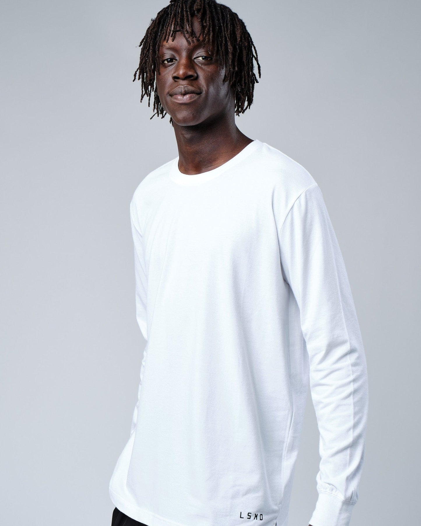 Model wearing Intensity FLXDRY Performance LS Tee - White