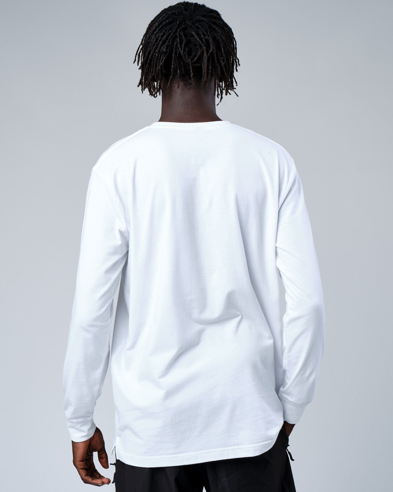 Model wearing Intensity FLXDRY Performance LS Tee - White