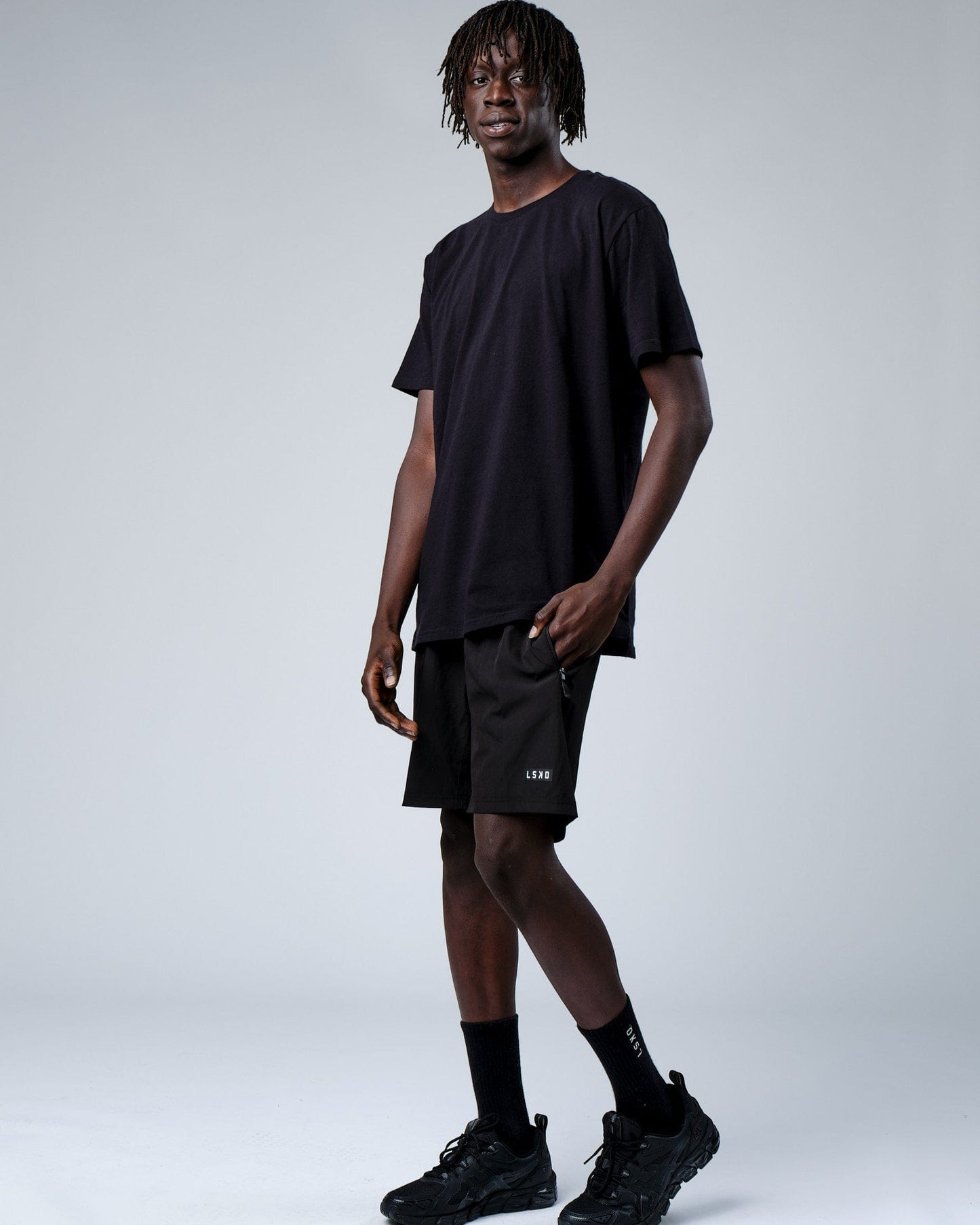 Model wearing Intensity FLXDRY Performance Tee - Black