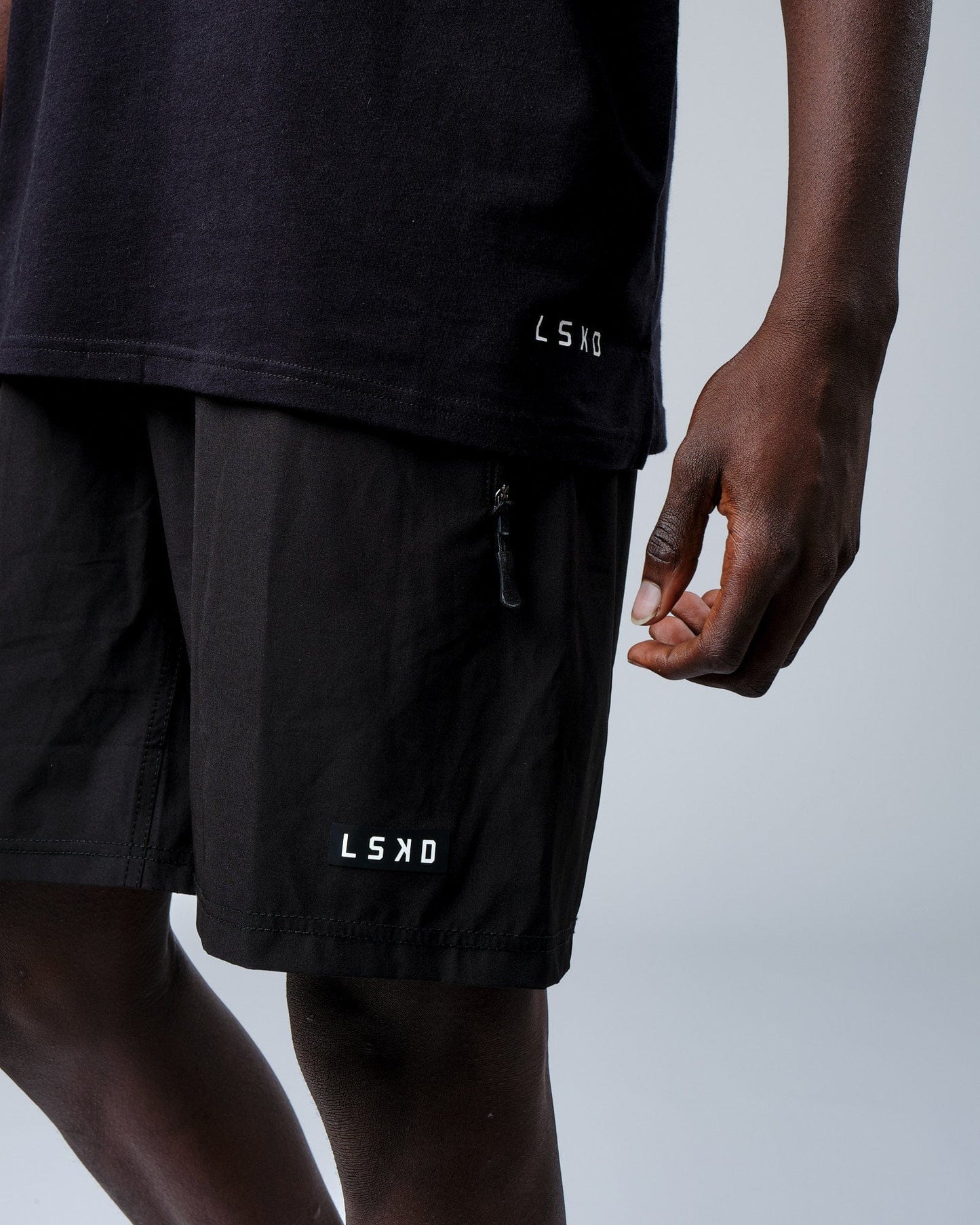 Model wearing Intensity FLXDRY Performance Tee - Black