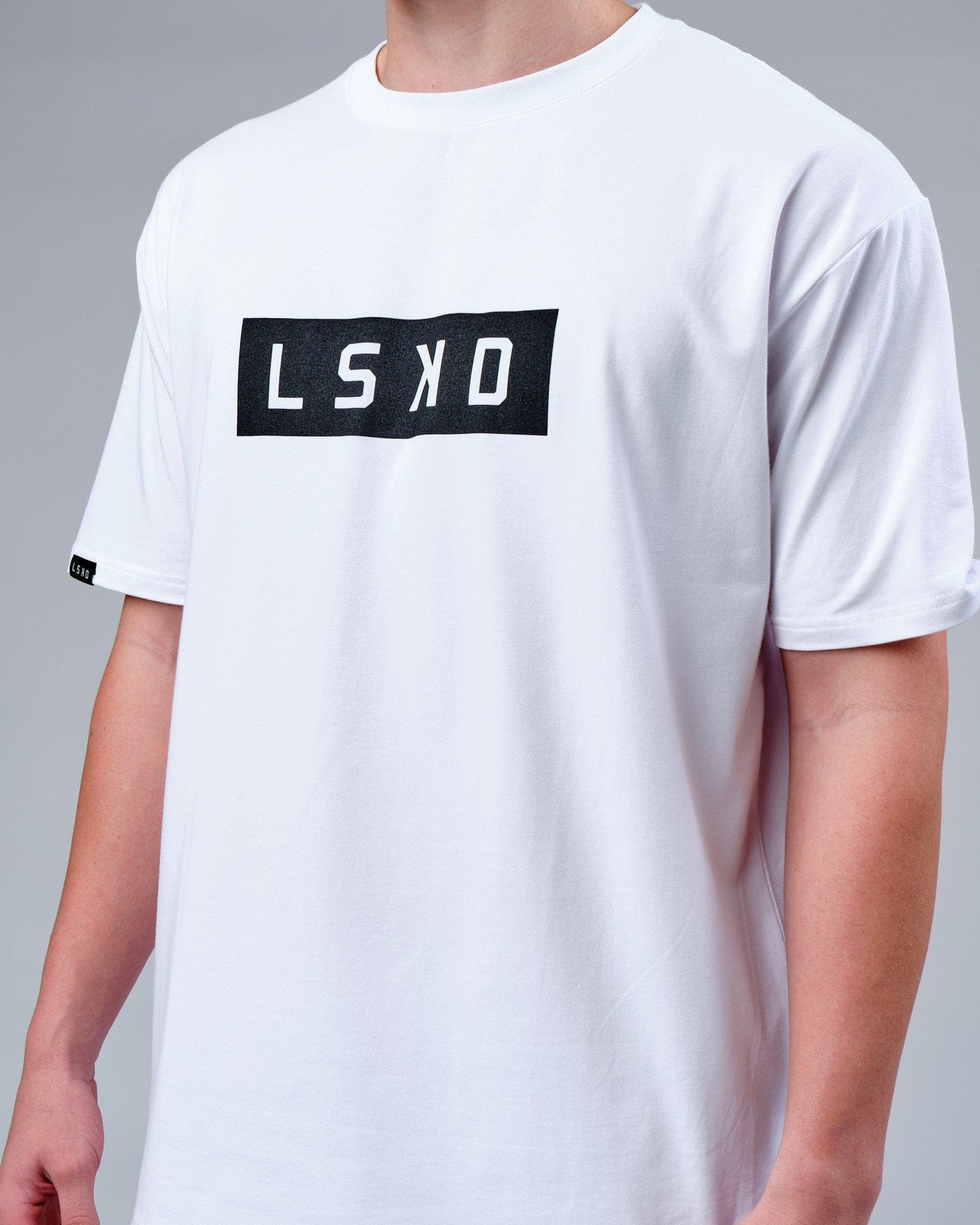 Model wearing Mood FLX Cotton Tee Oversize - White-Black