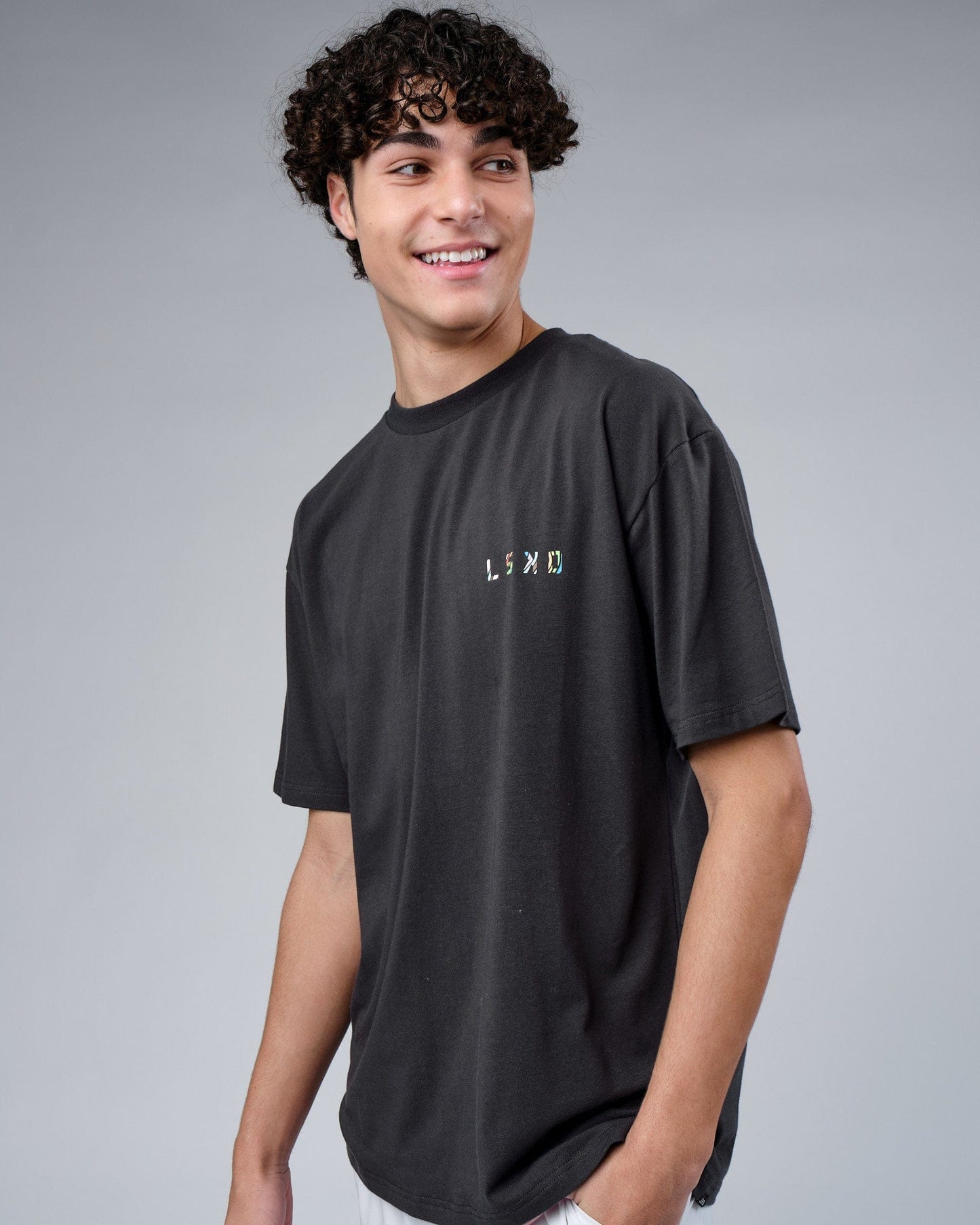 Model wearing Unity FLXCotton Tee Oversize - Pirate Black