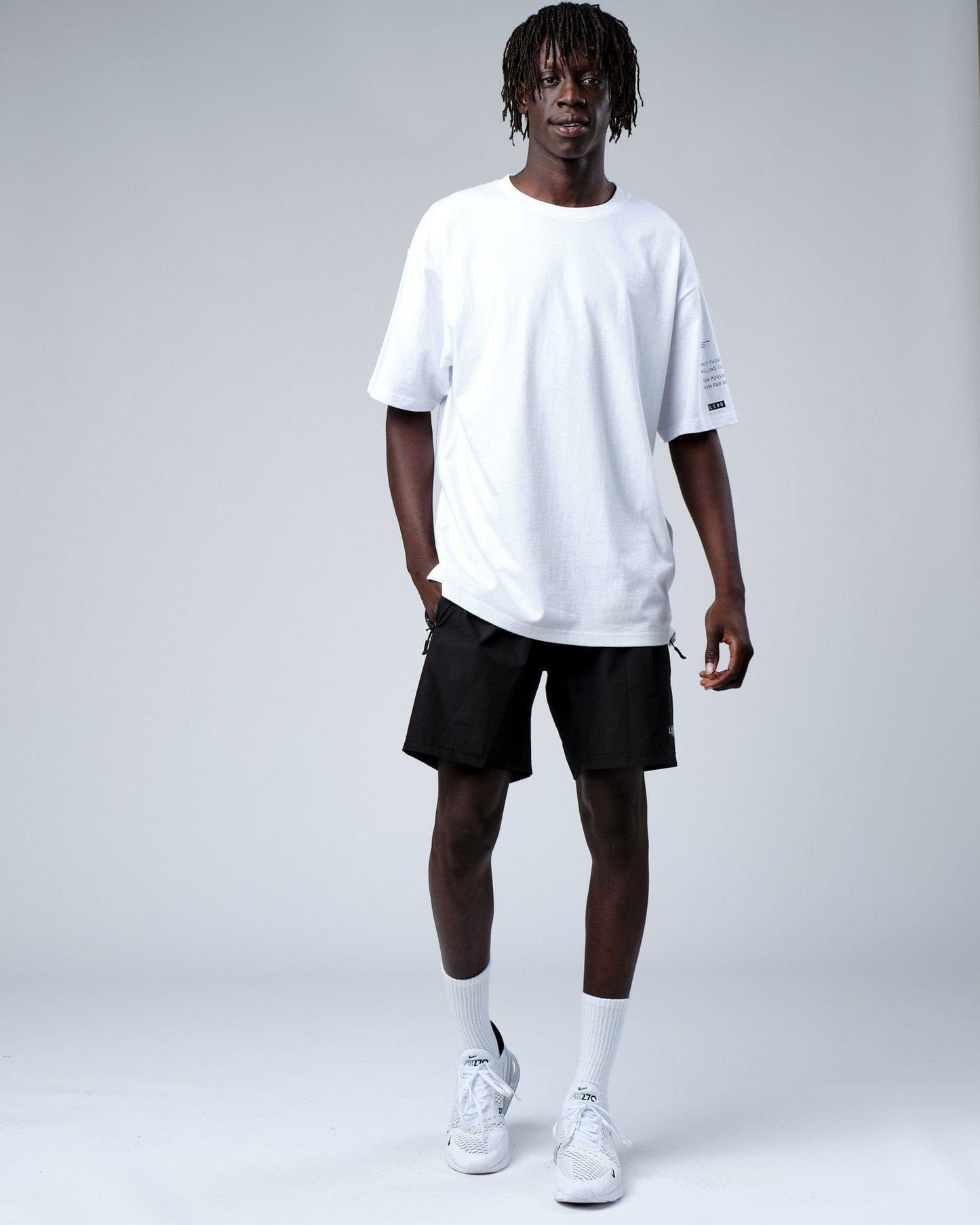 Model wearing Effort Tee Oversize - White