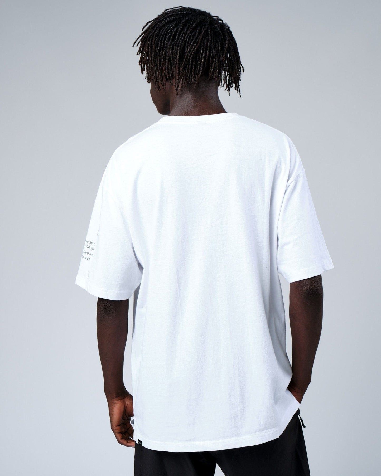 Model wearing Effort Tee Oversize - White