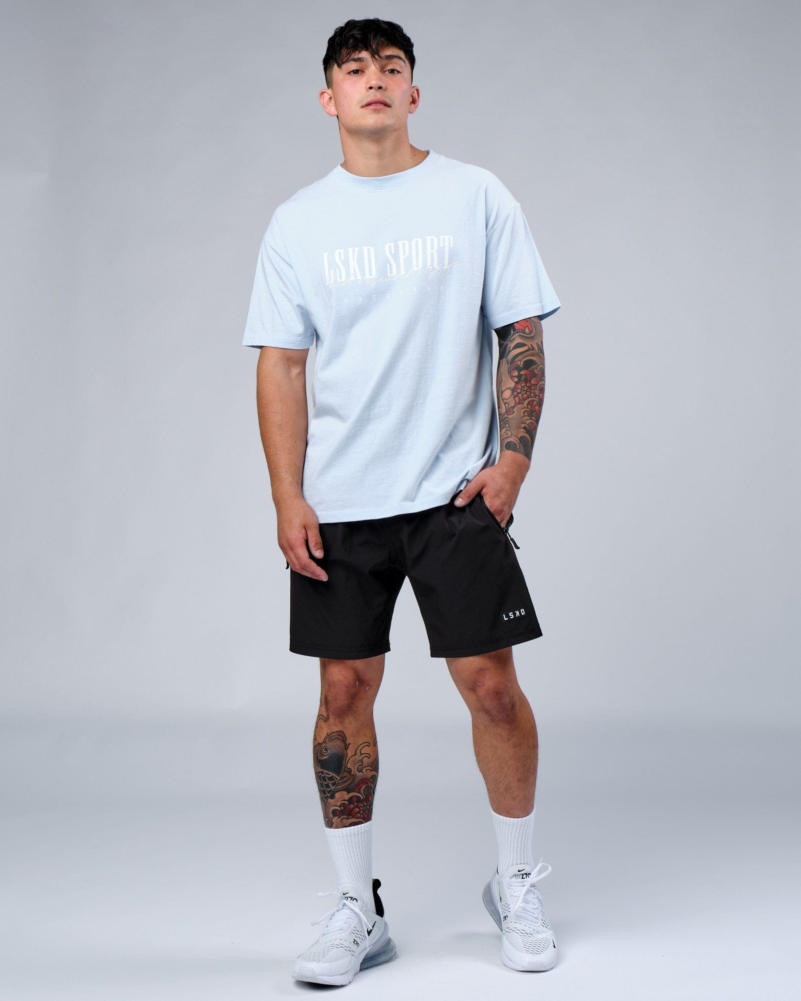 Model wearing Faculty Tee Vintage Fit - Sky Blue