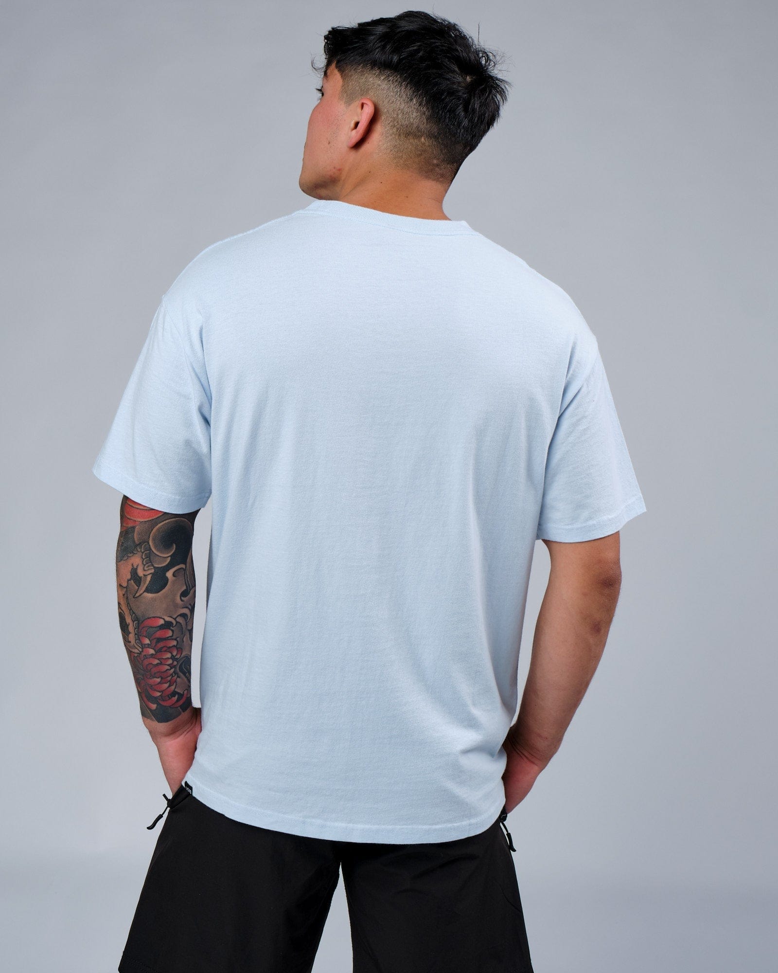 Model wearing Faculty Tee Vintage Fit - Sky Blue