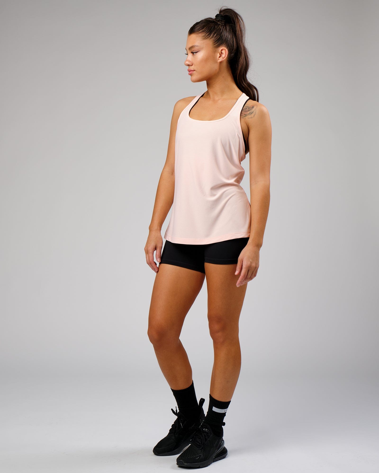 Model wearing Freedom Performance Tank - Pink
