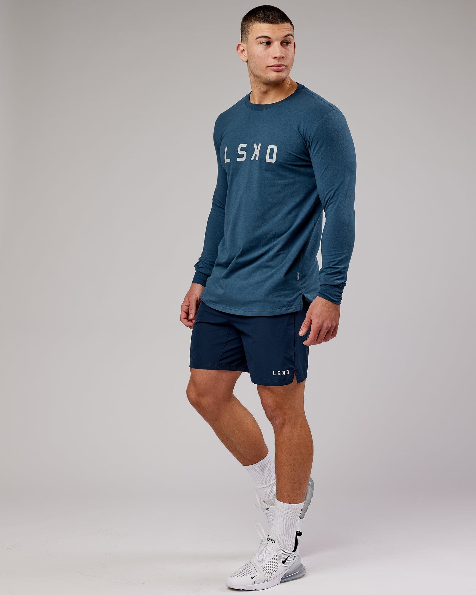 Model wearing Power FLXDRY Performance LS Tee - Light Navy