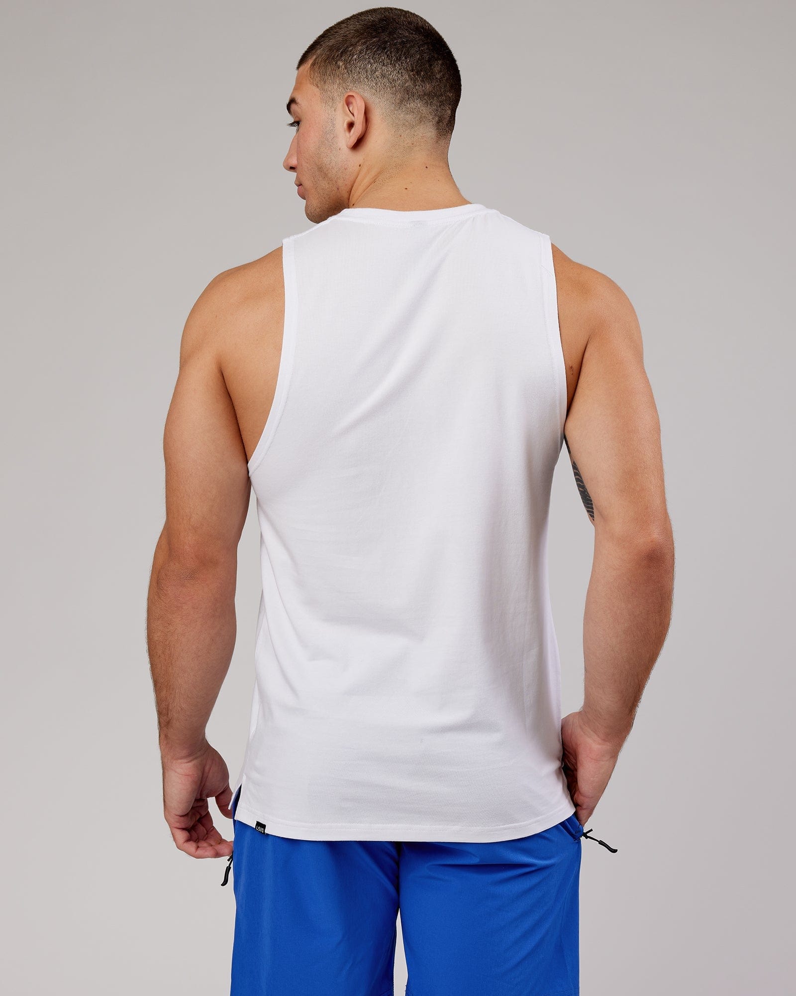 Model wearing Expand FLXCotton Training Fit Tank - White-Cobalt