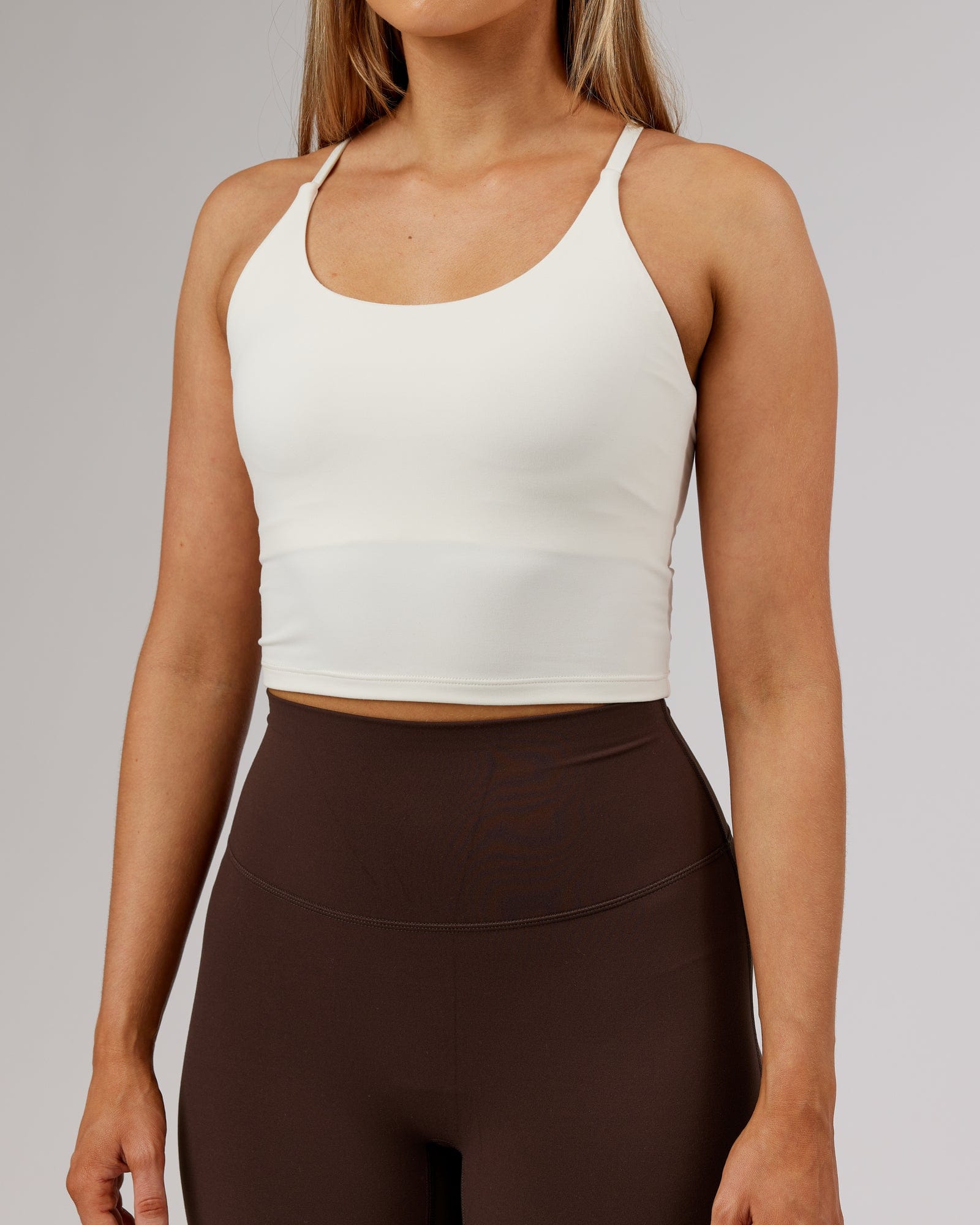 Model wearing Elixir Active Tank - Cream