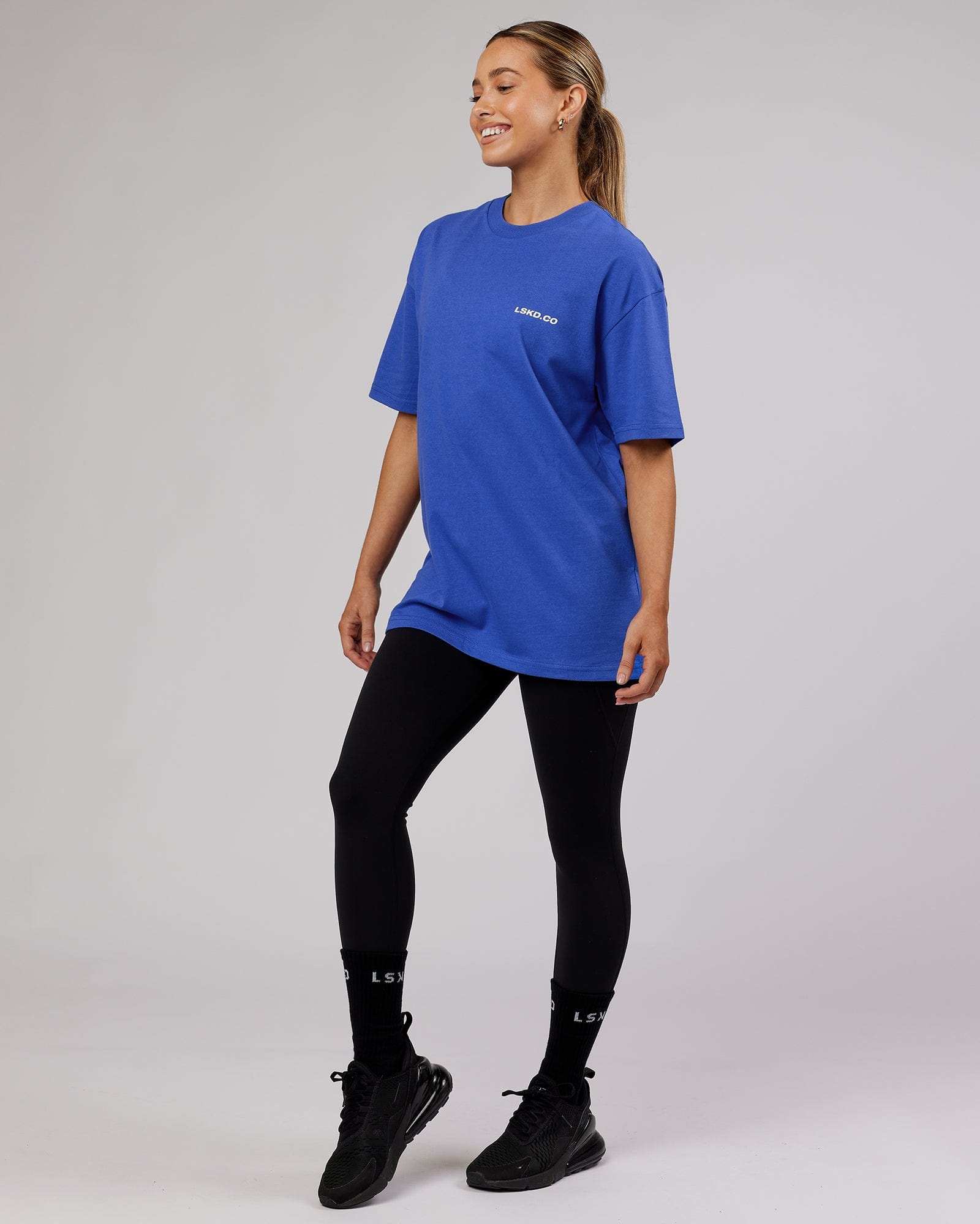 Model wearing Unisex Revolution Heavyweight Tee Oversize - Power Cobalt