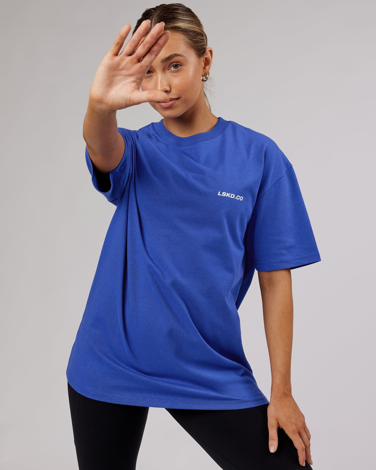 Model wearing Unisex Revolution Heavyweight Tee Oversize - Power Cobalt