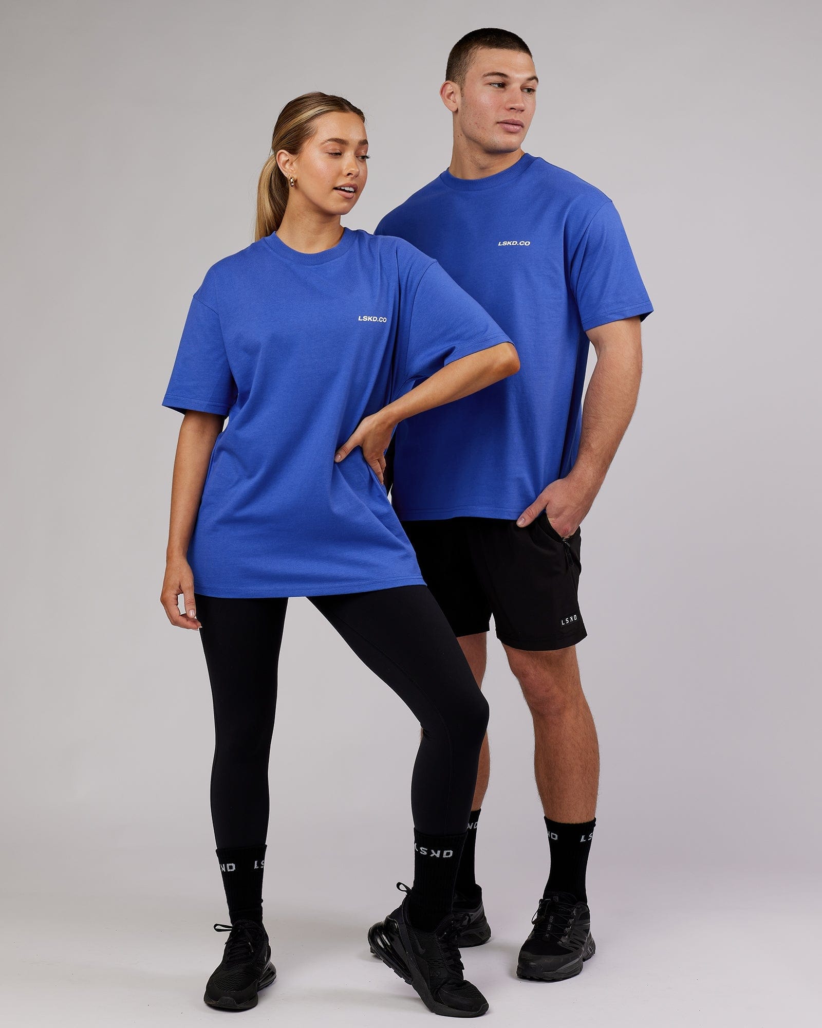 Model wearing Unisex Revolution Heavyweight Tee Oversize - Power Cobalt