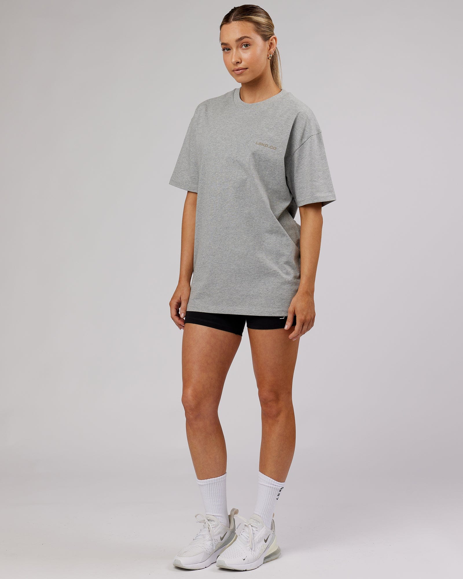 Model wearing Unisex Revolution Heavyweight Tee Oversize - Lt Grey Marl