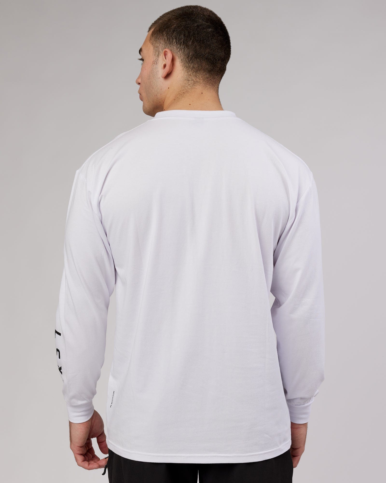 Model wearing Extensor FLXCotton LS Tee Oversize - White