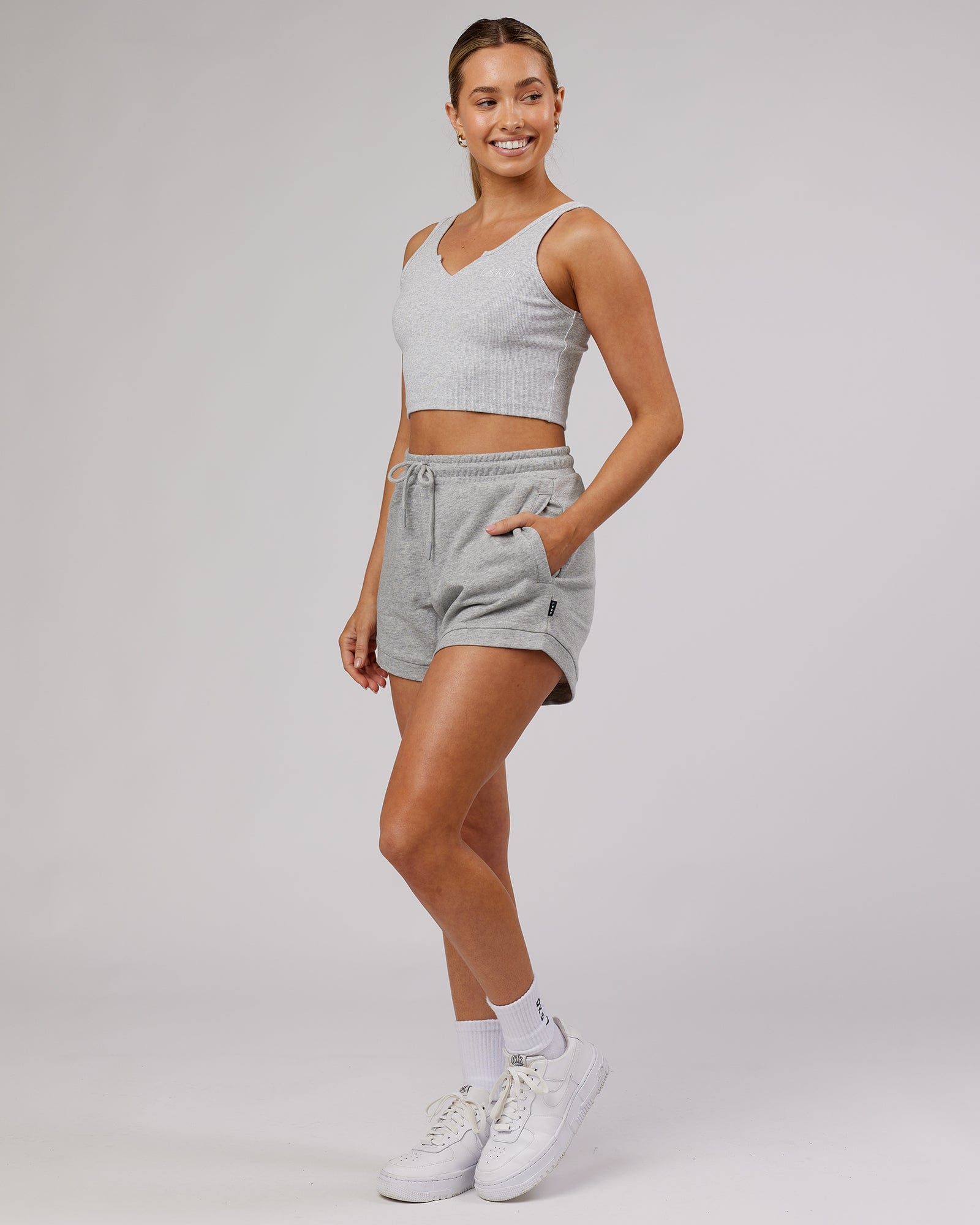 Model wearing Field Ribbed V-Neck Tank - Lt Grey Marl