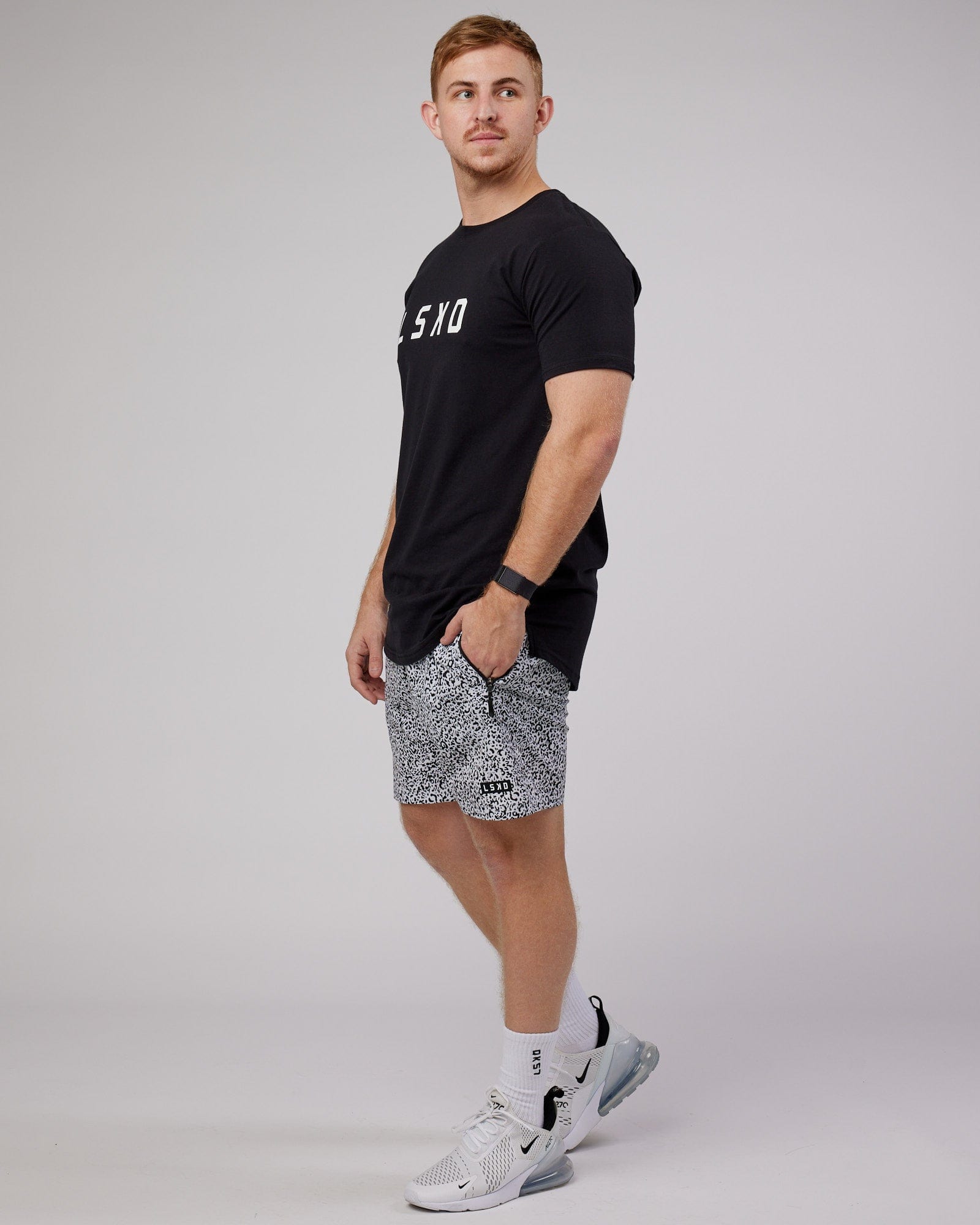 Model wearing Rep 7" Performance Short - Spotty White-Black