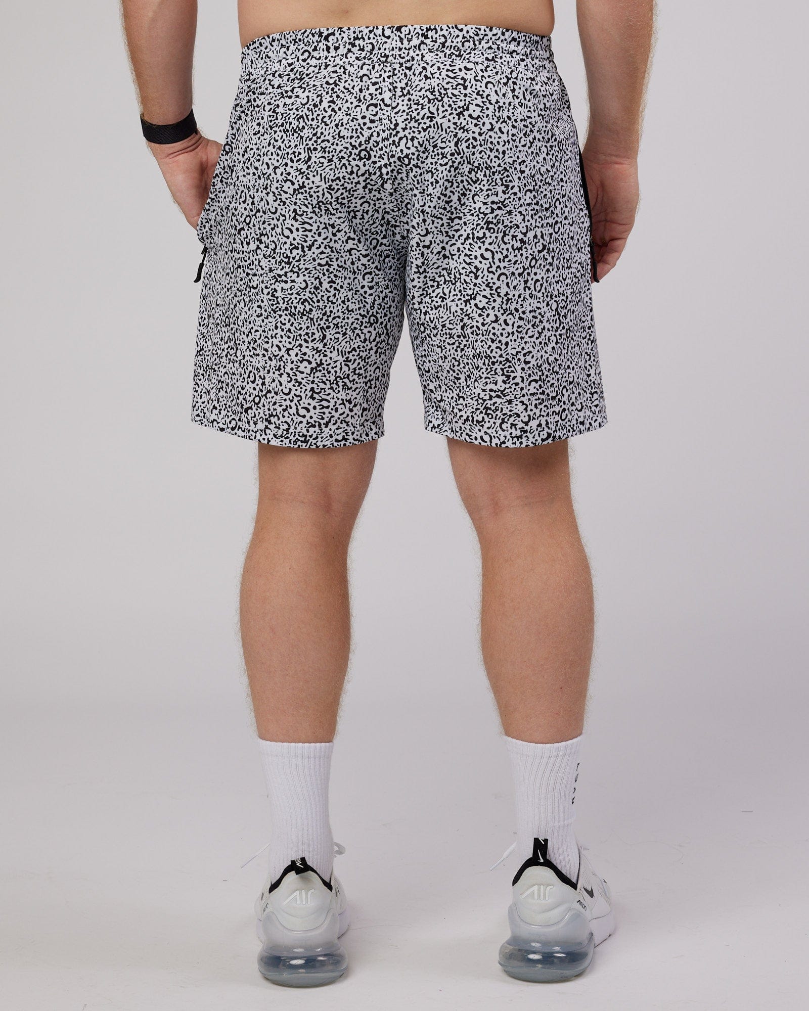 Model wearing Rep 7" Performance Short - Spotty White-Black
