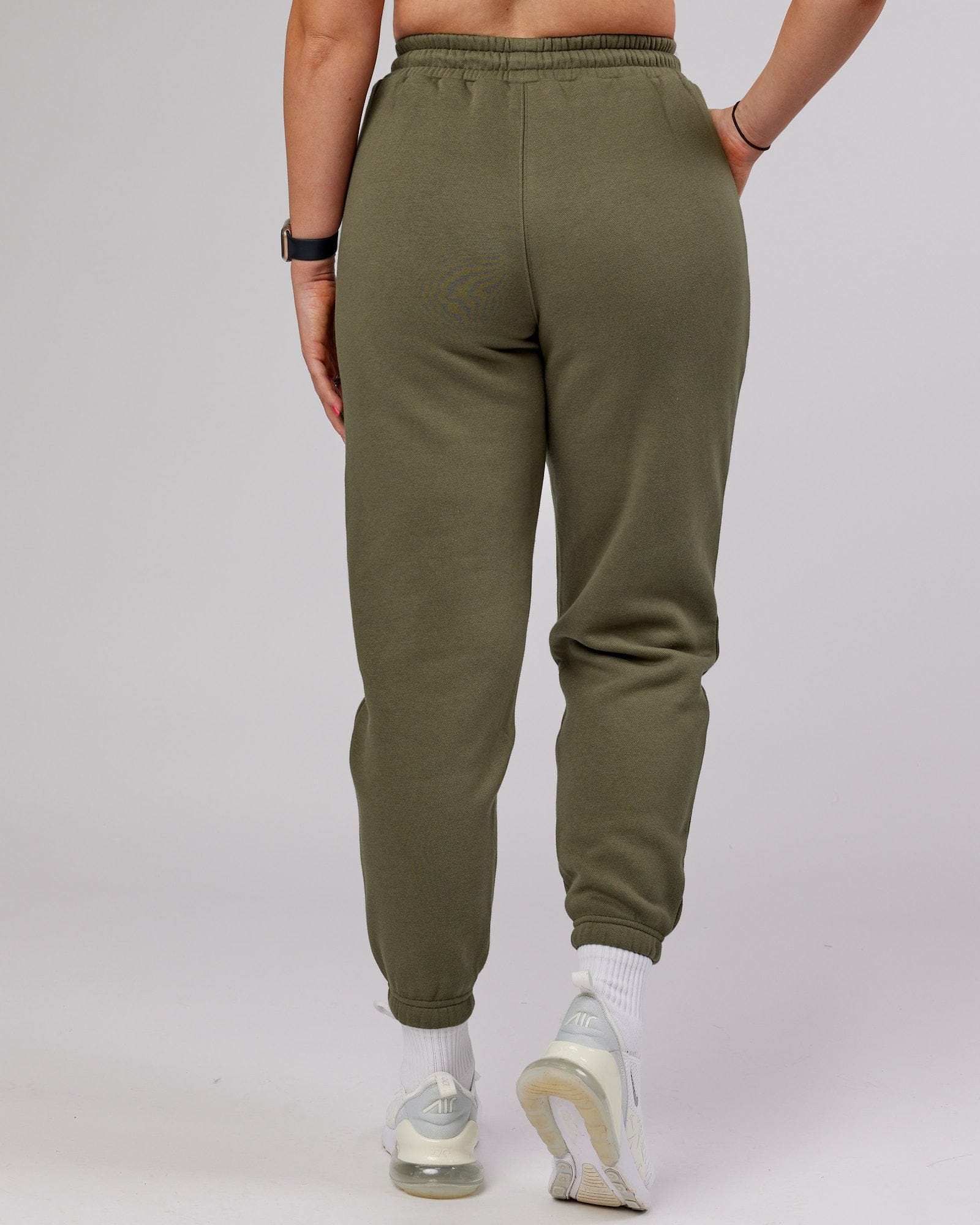 Model wearing Becca Track Pant - Olive Fade