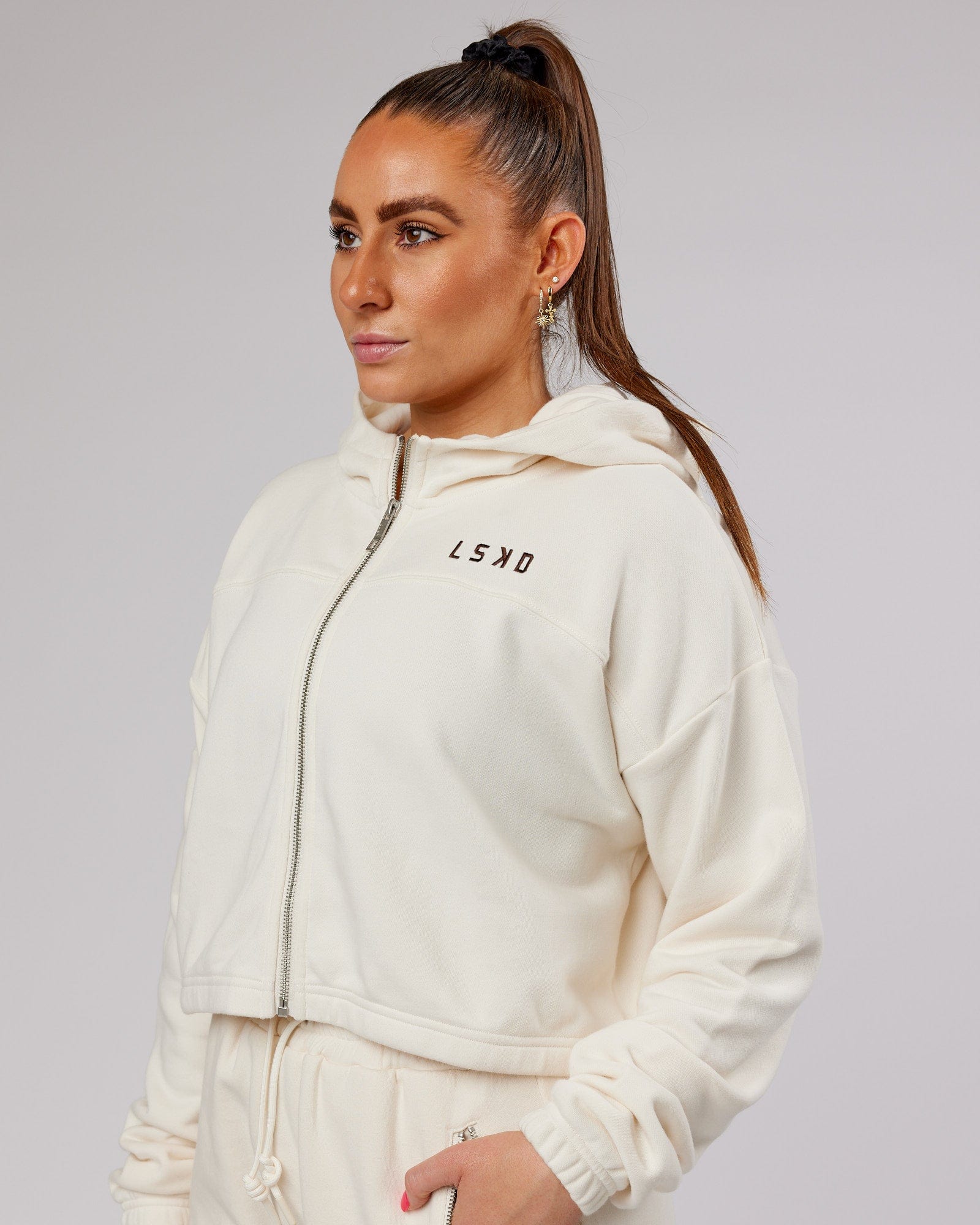 Model wearing Bridge Zip Through Hoodie - Cream