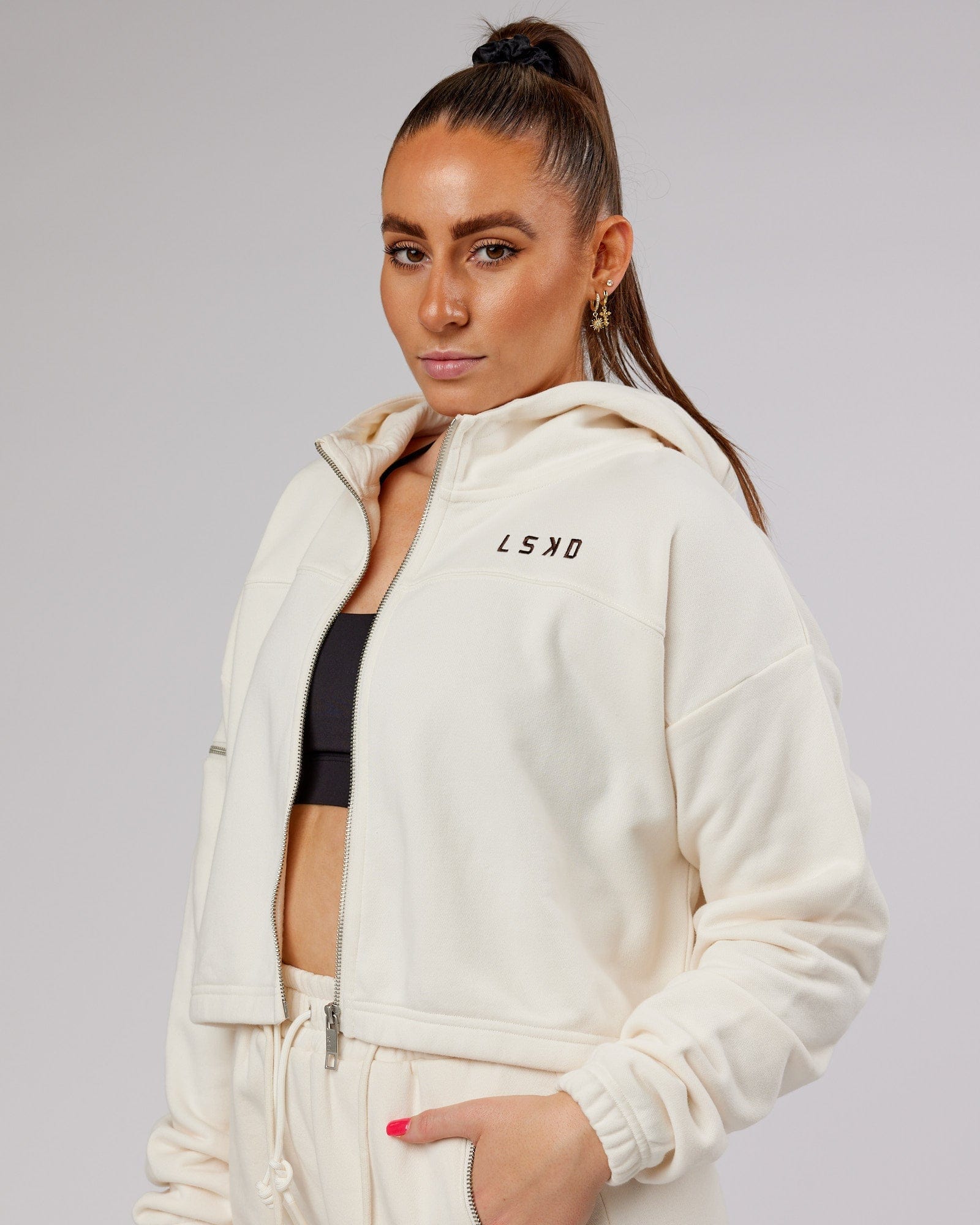 Model wearing Bridge Zip Through Hoodie - Cream
