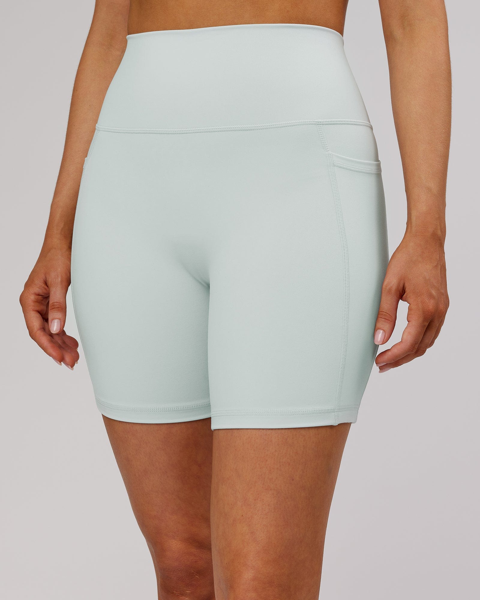 Model wearing Fusion Mid Short TIght - Ballad Blue