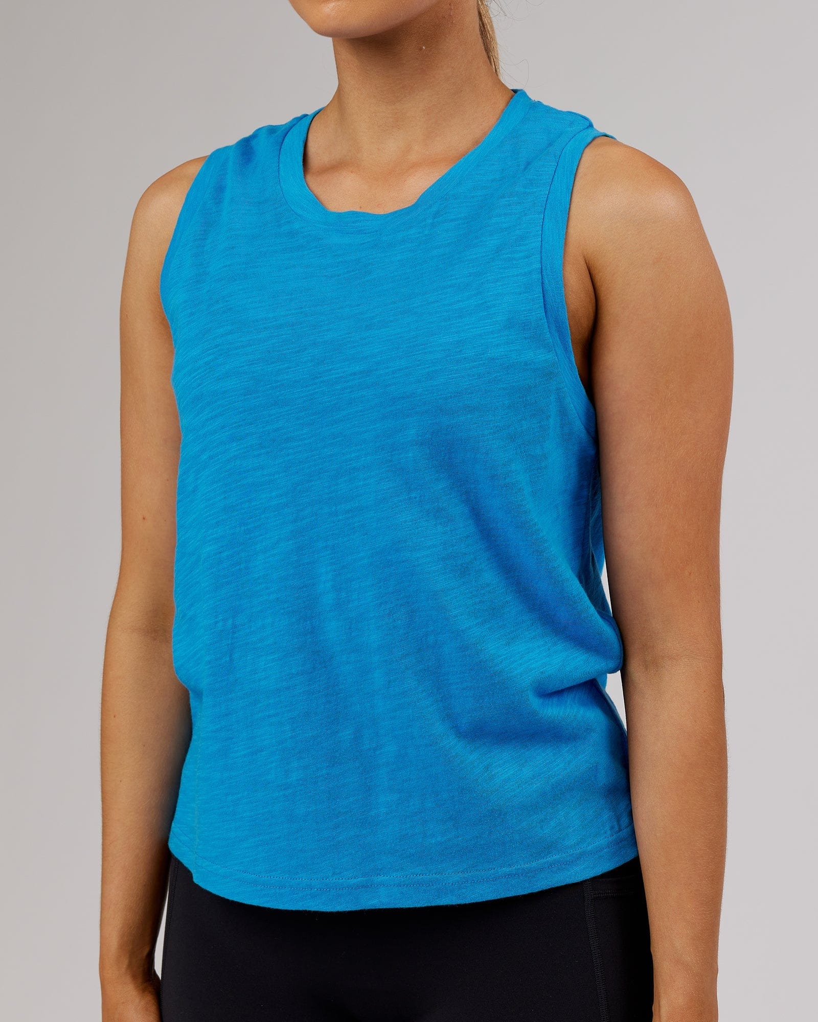 Model wearing Breathe Tank - Ibiza Blue