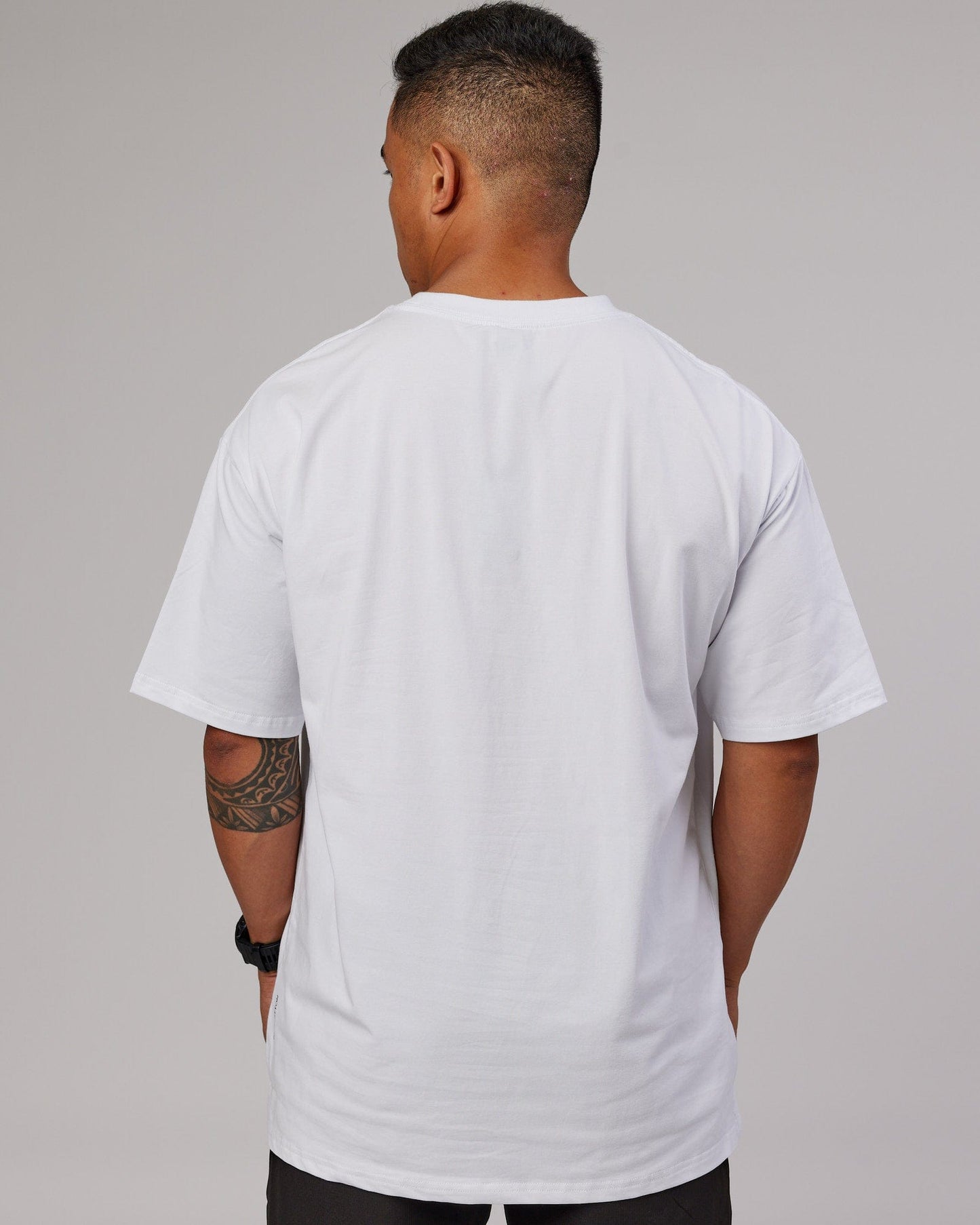 Model wearing 1% Better FLXCotton Tee Oversize - White