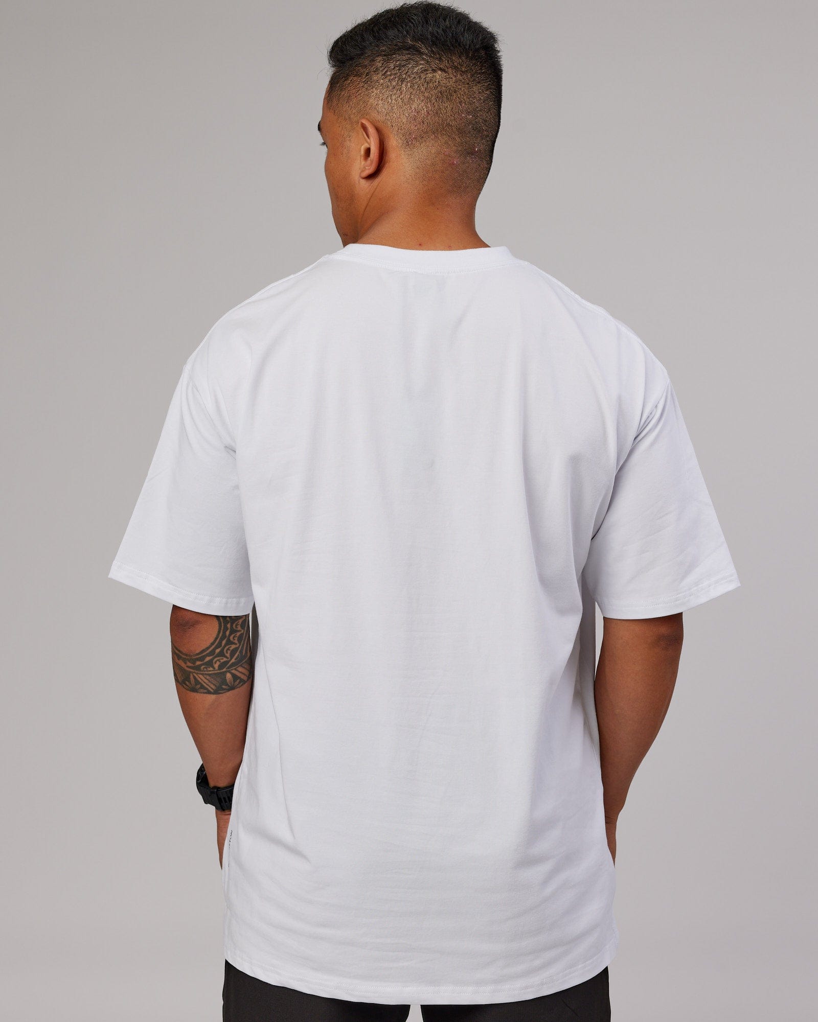 Model wearing 1% Better FLXCotton Tee Oversize - White