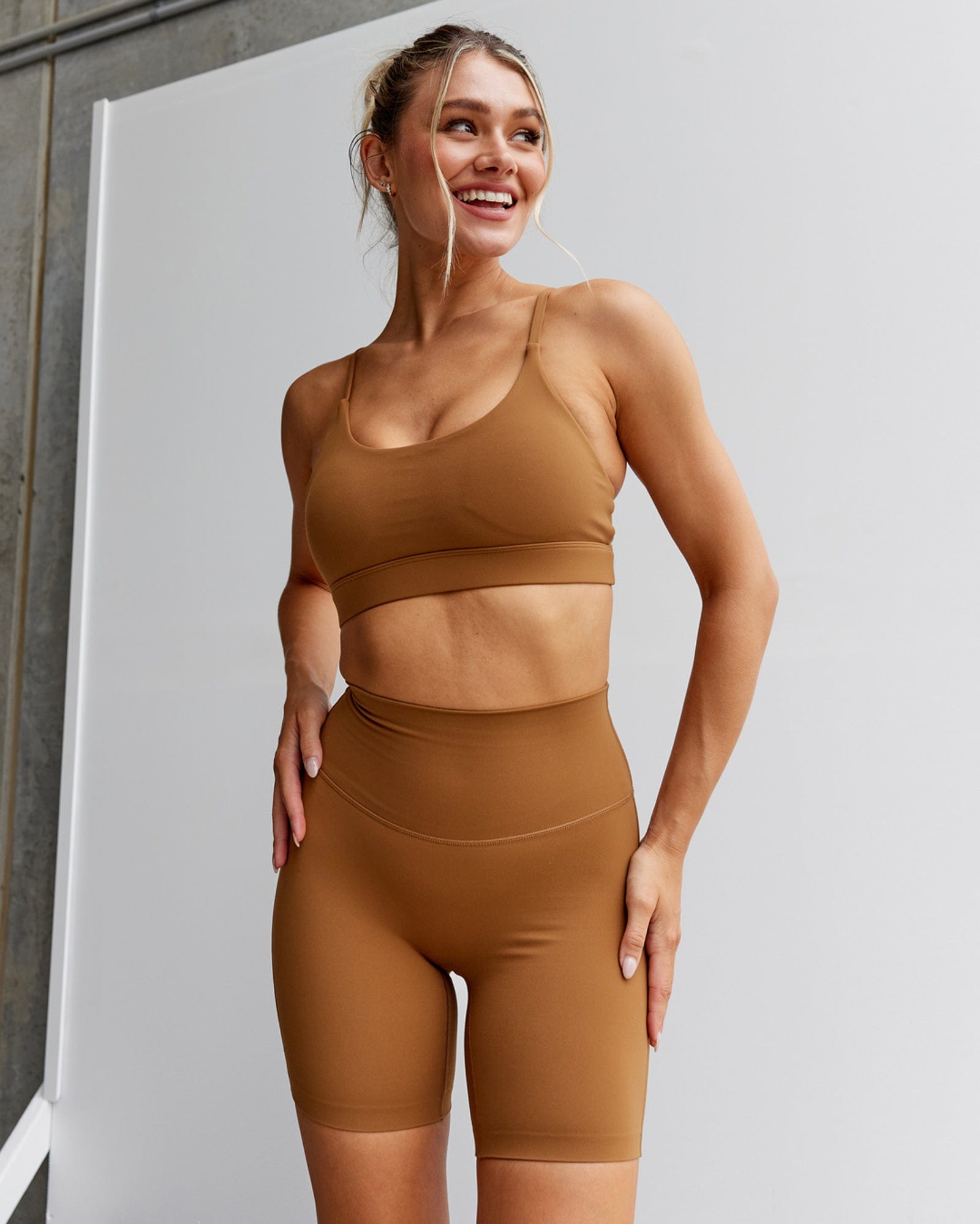 Model wearing Elixir Sports Bra - Camel