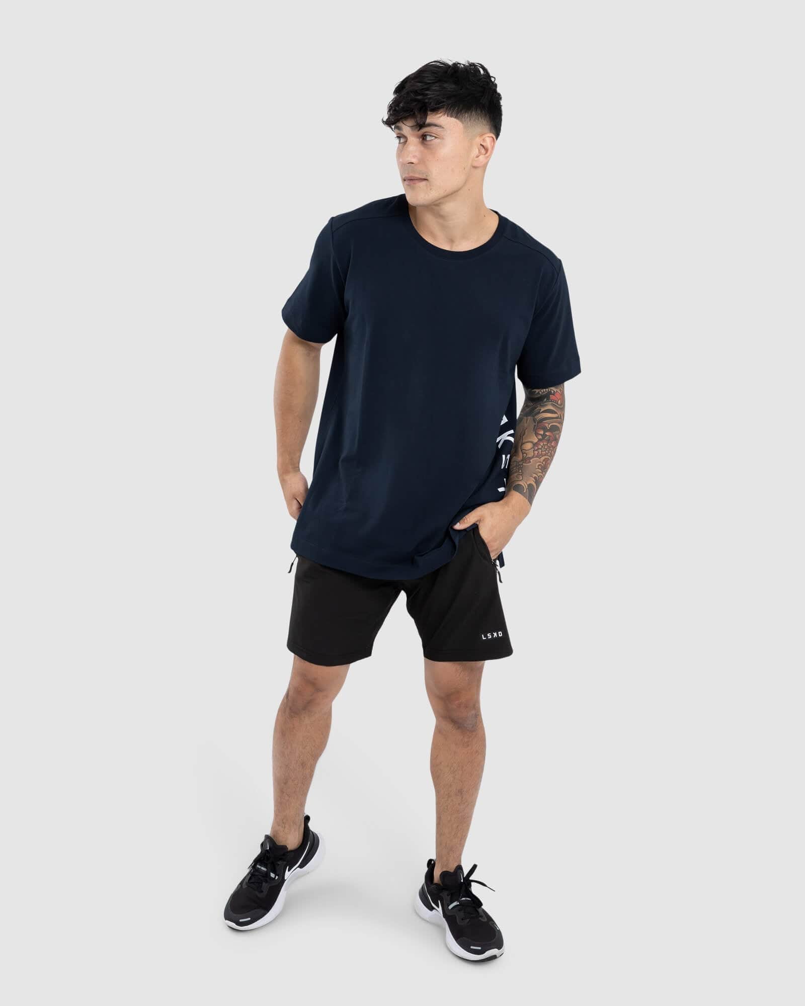 Model wearing Flex Tee - Carbon