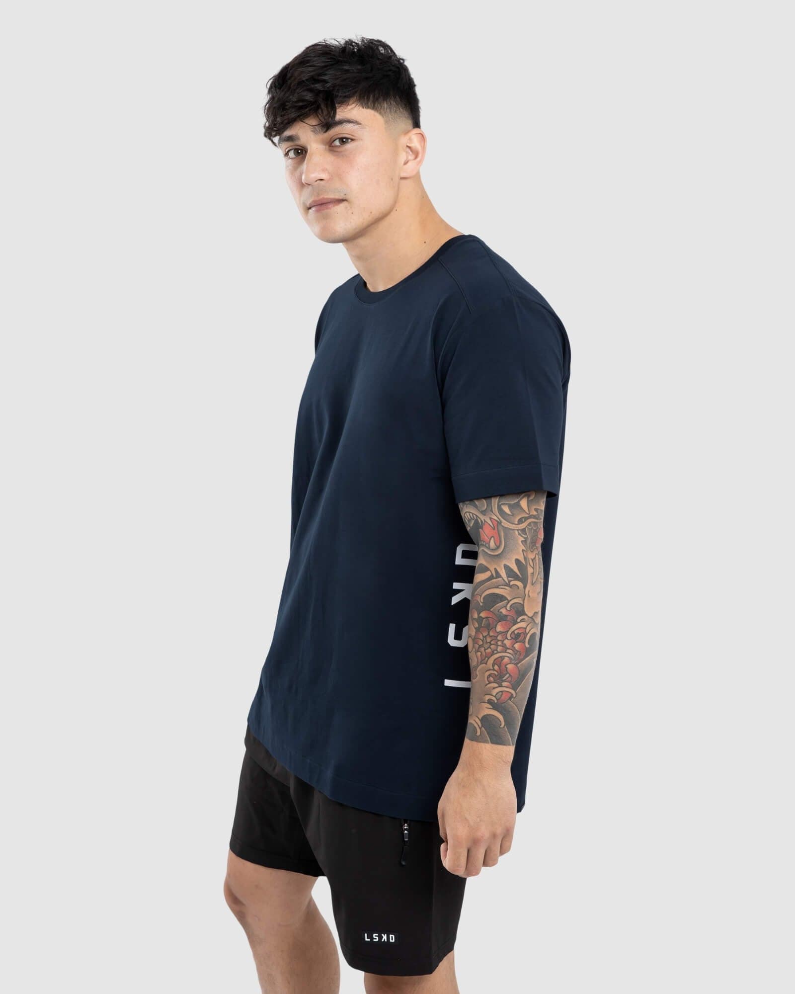 Model wearing Flex Tee - Carbon