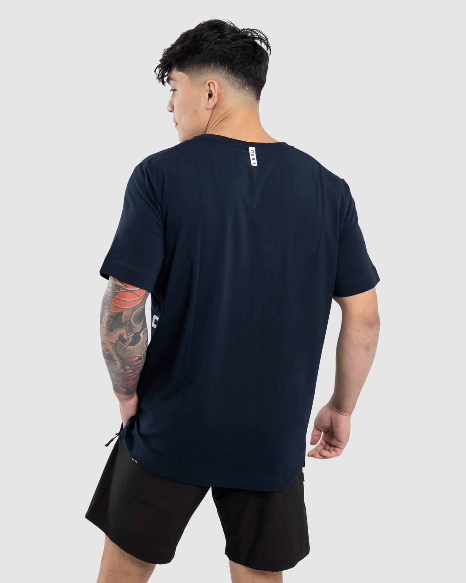 Model wearing Flex Tee - Carbon