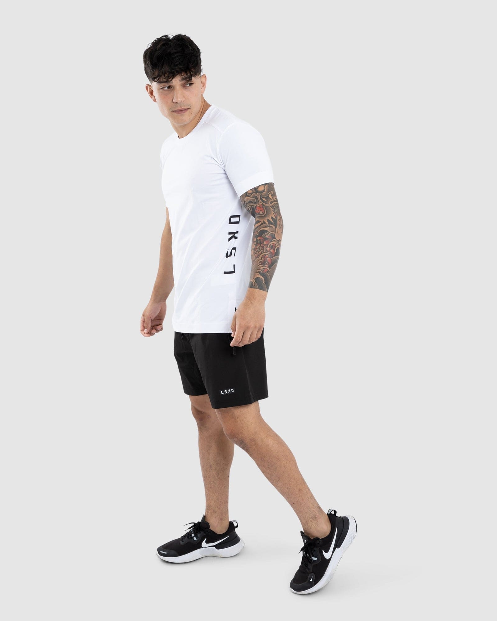 Model wearing Flex Tee - White