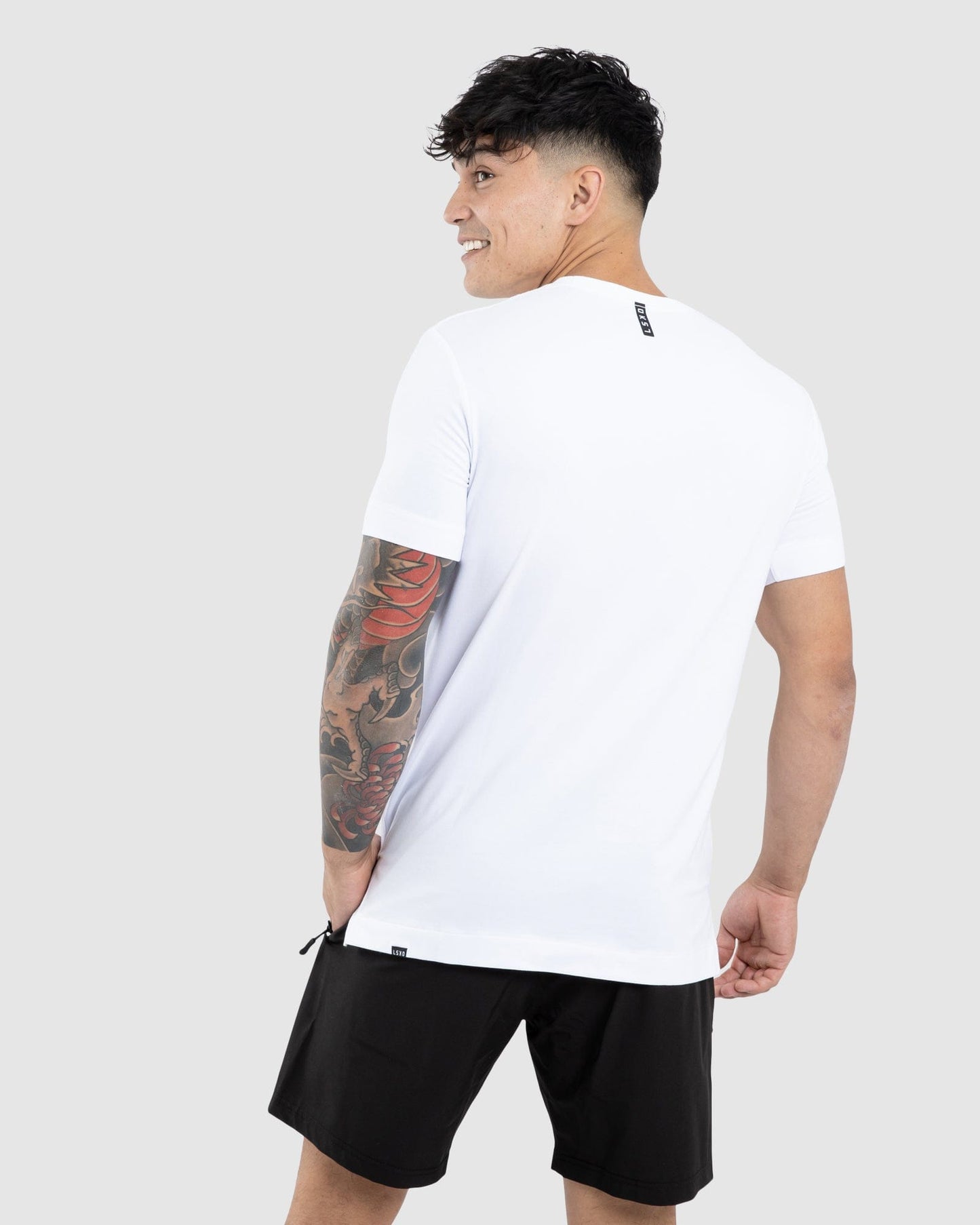 Model wearing Flex Tee - White