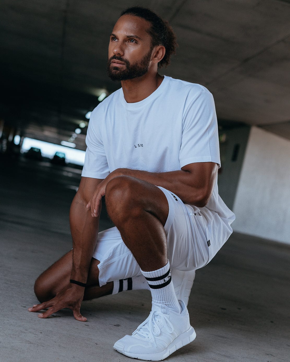 Model wearing Base Tee - White